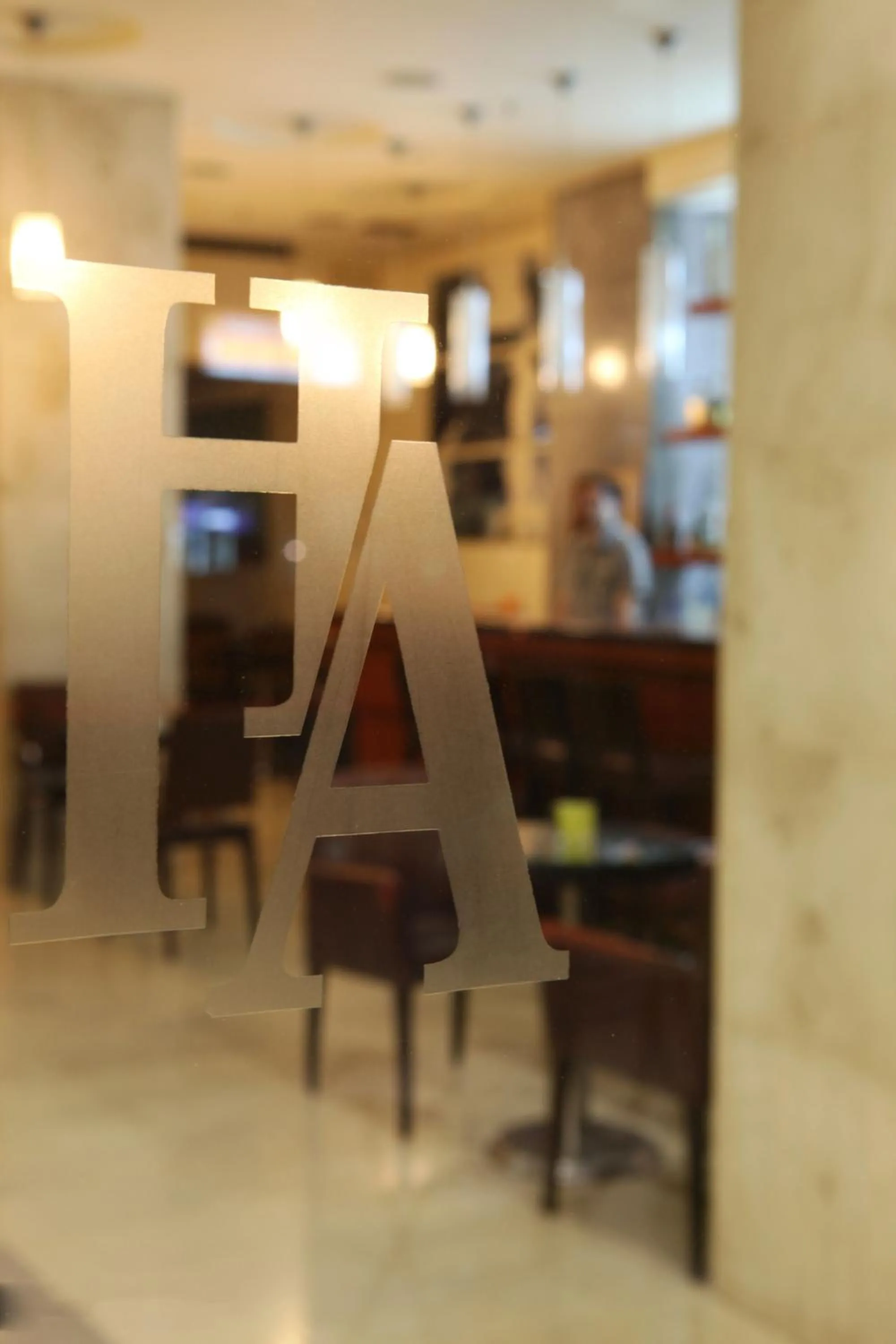 Property logo or sign in Hotel Alfa