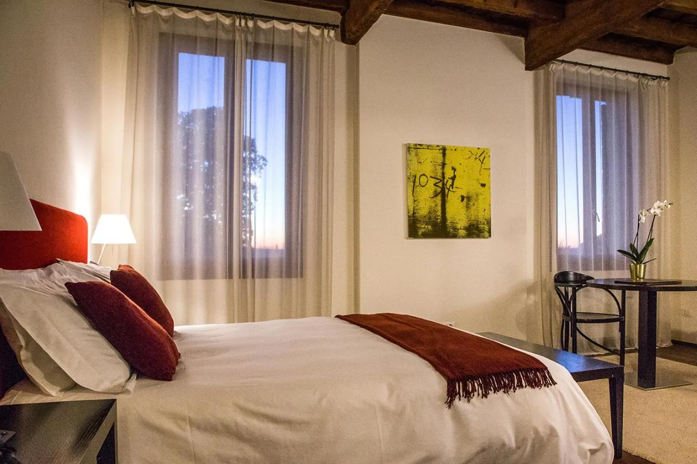 Bed in Relais Villa Ormaneto