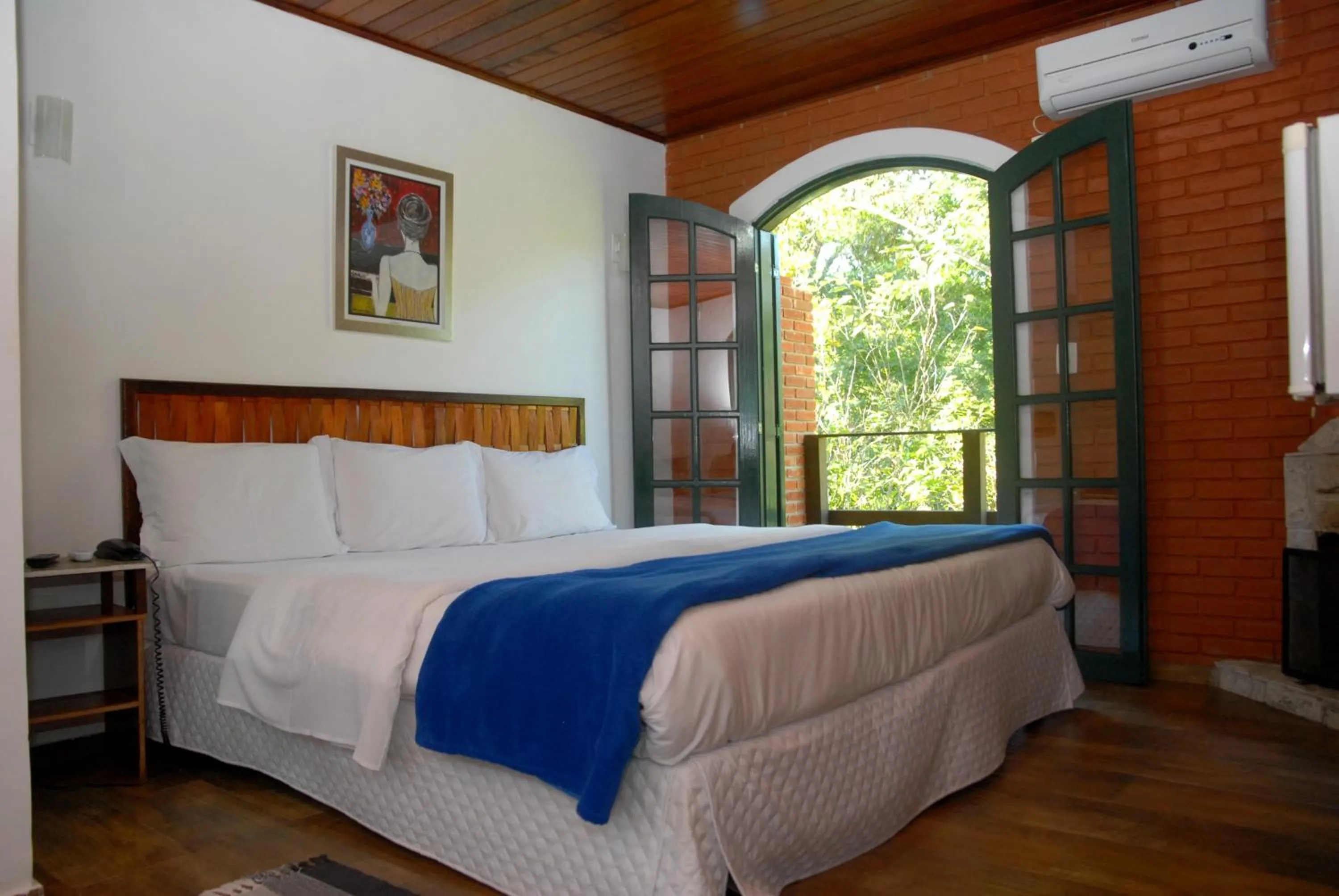 Bed in Pousada Mirante do Penedo