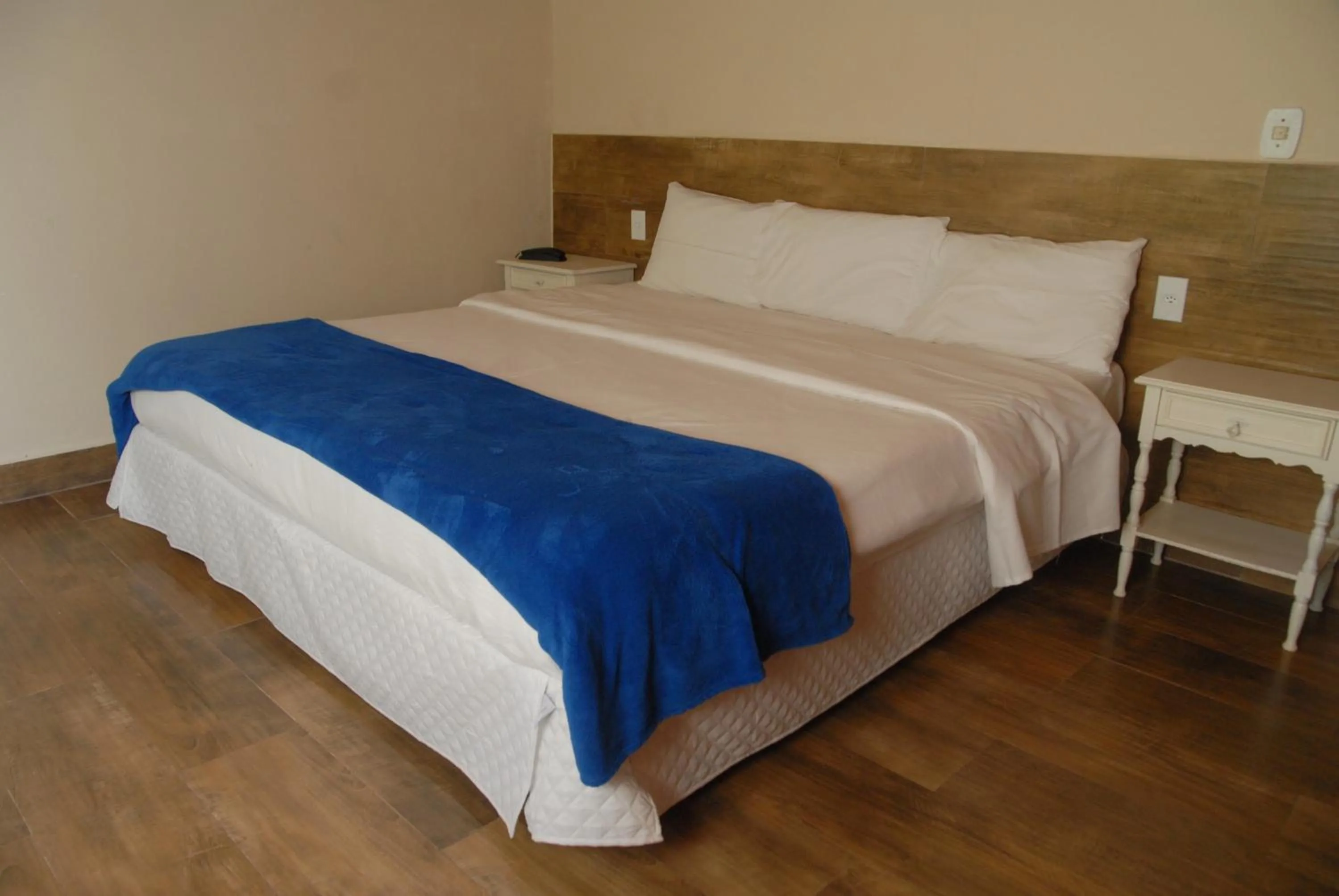 Bed in Pousada Mirante do Penedo