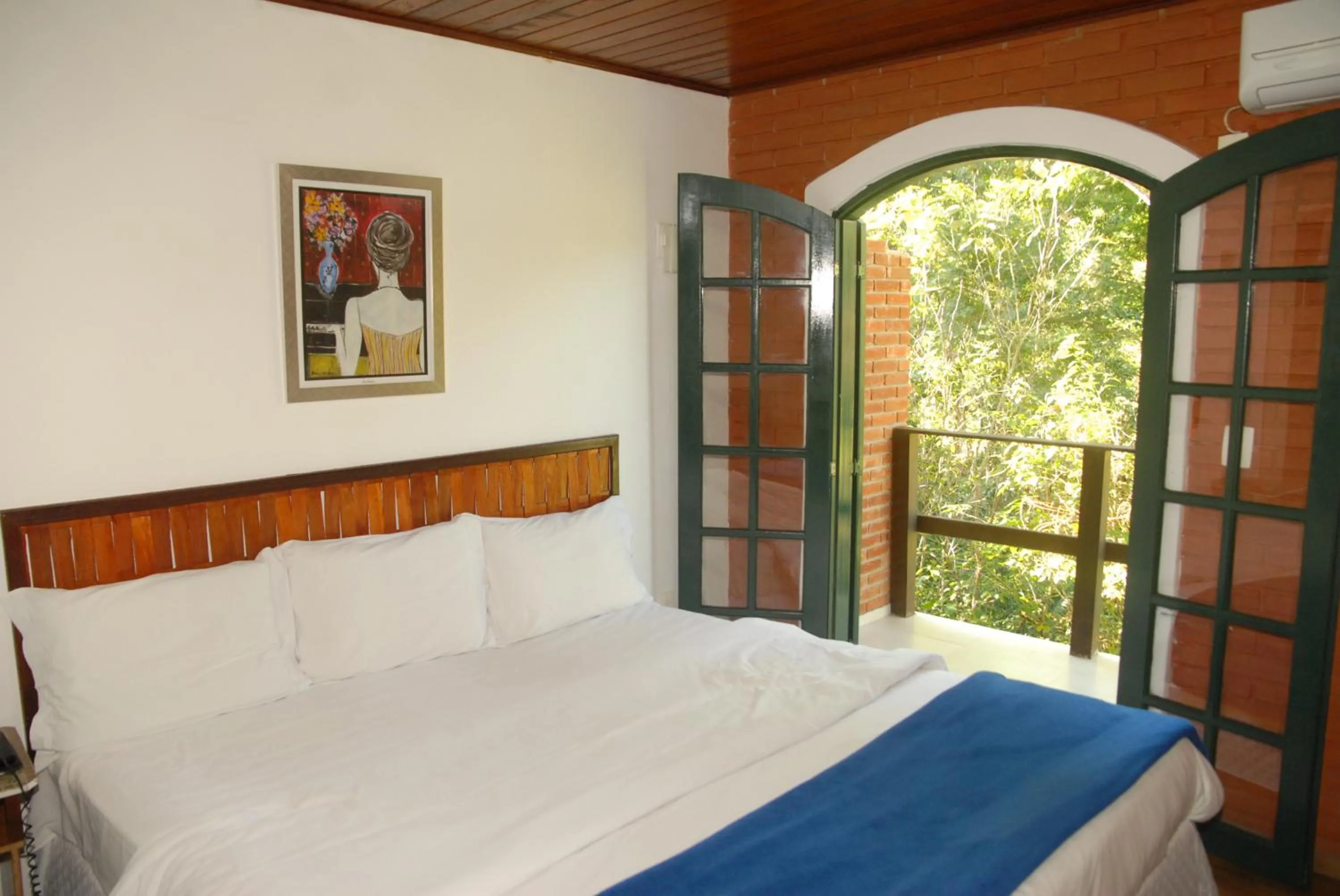 Bed in Pousada Mirante do Penedo