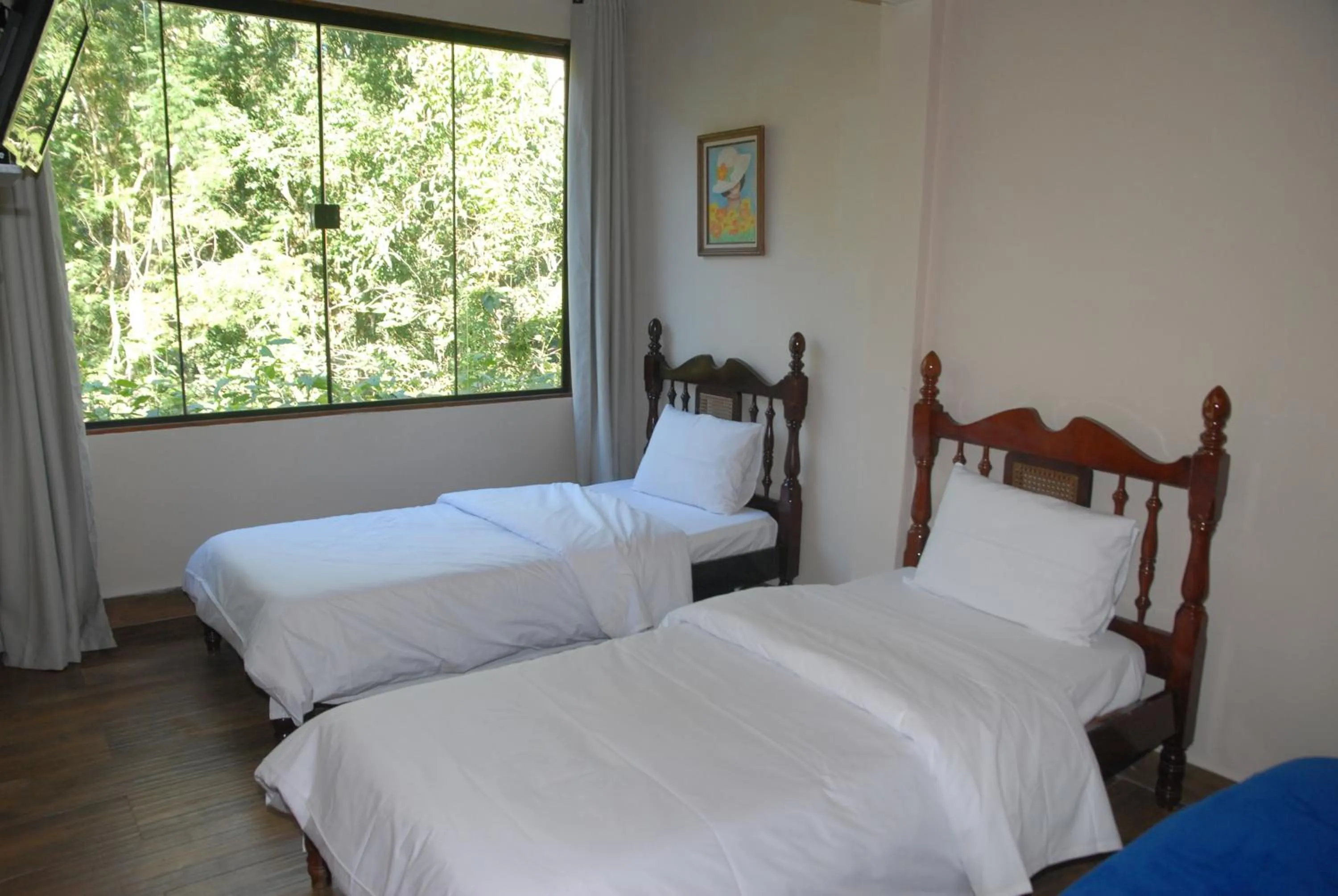 Bed in Pousada Mirante do Penedo