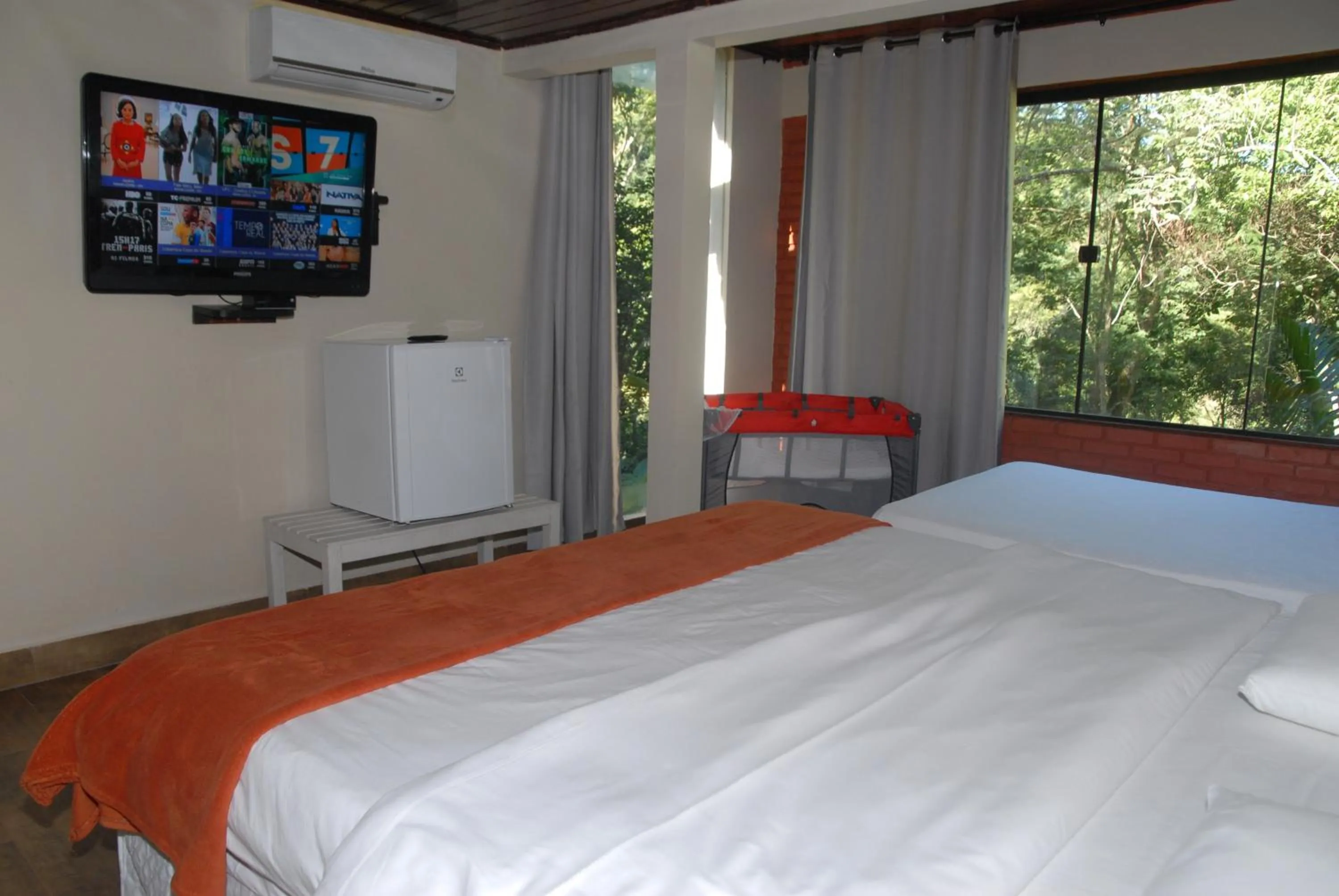 Bed in Pousada Mirante do Penedo