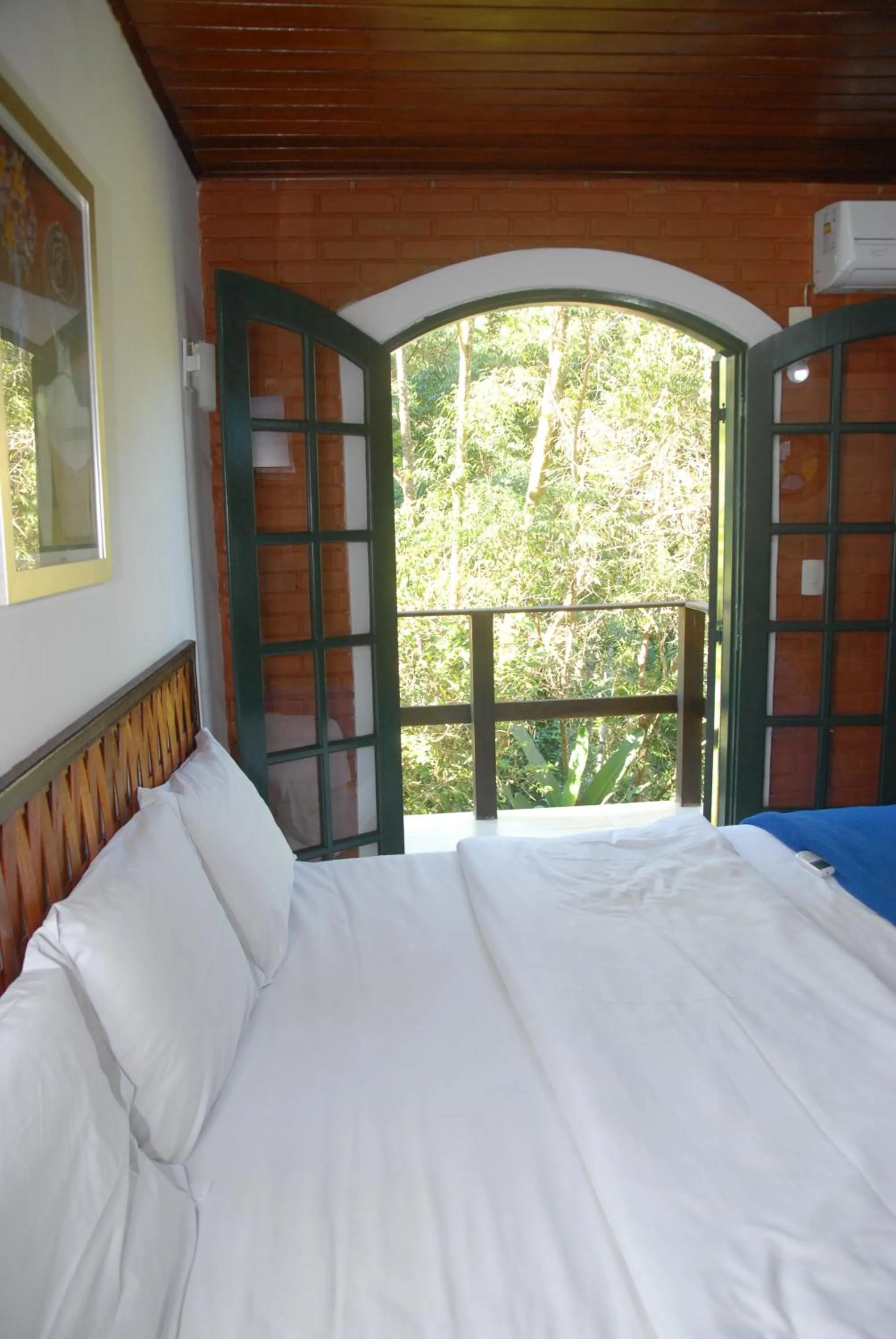 Bed in Pousada Mirante do Penedo