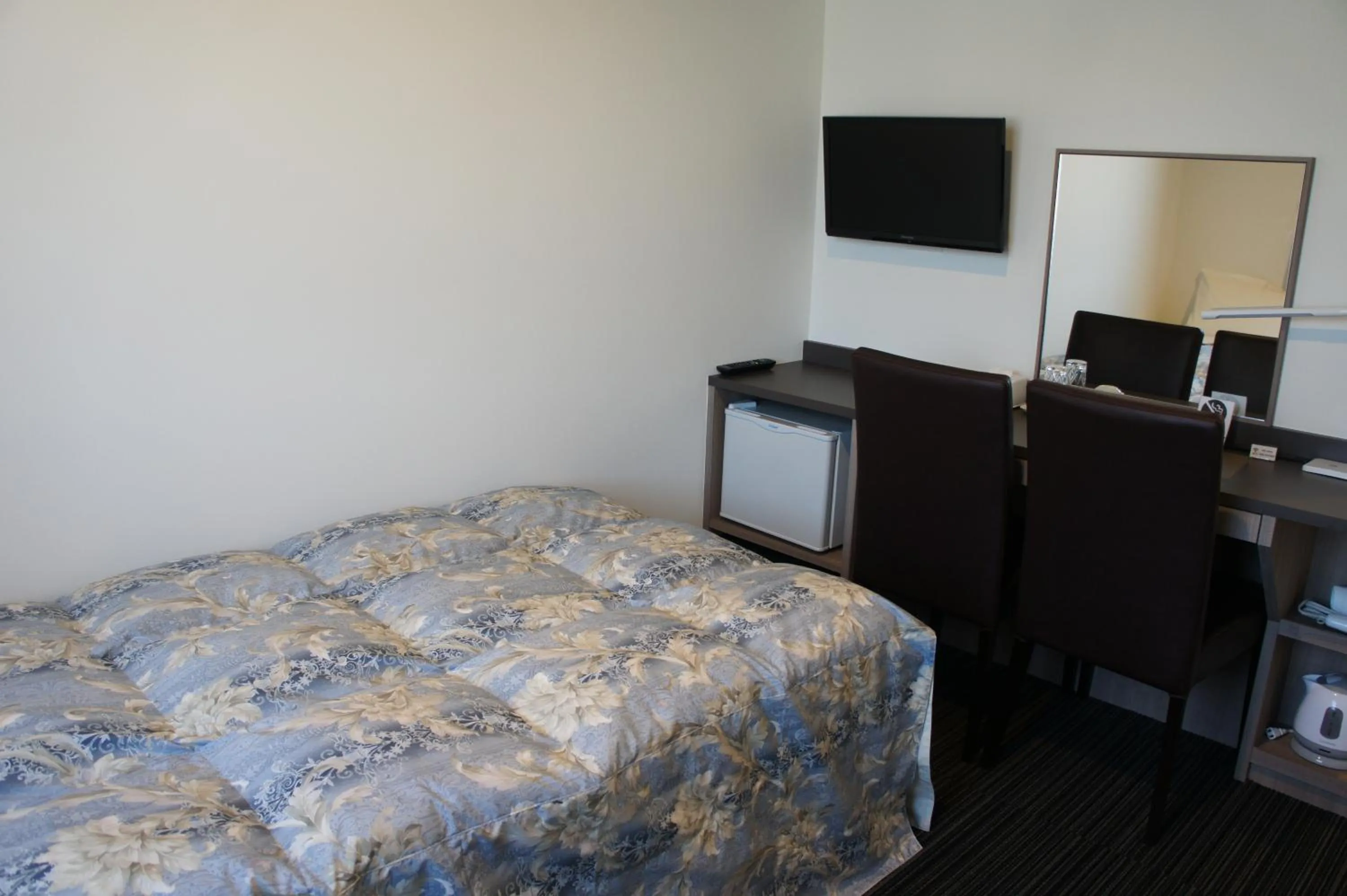 Bed in Murayama Nishiguchi Hotel