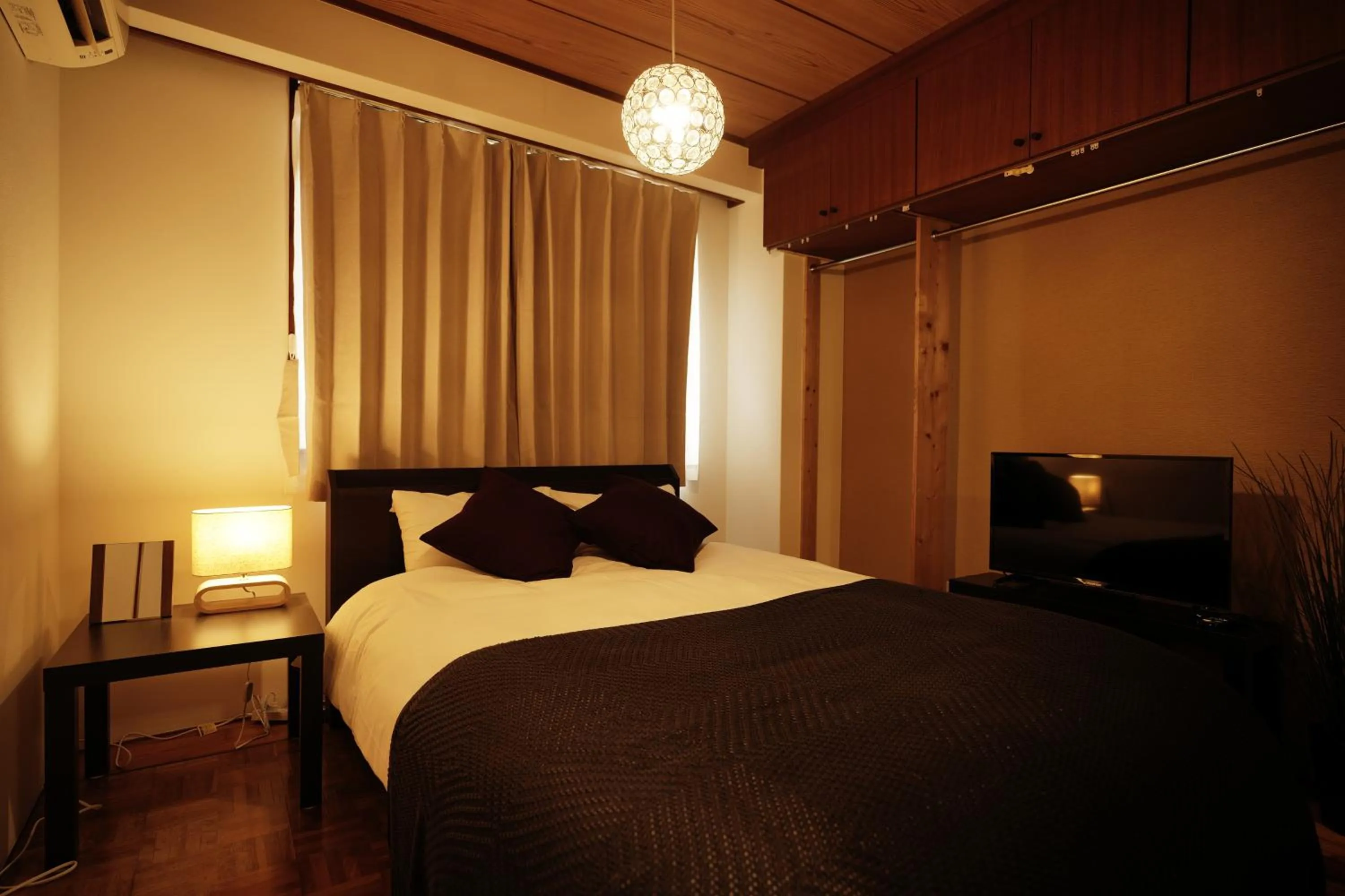 Bedroom, Bed in Naha Southerlies Condominium Kumoji