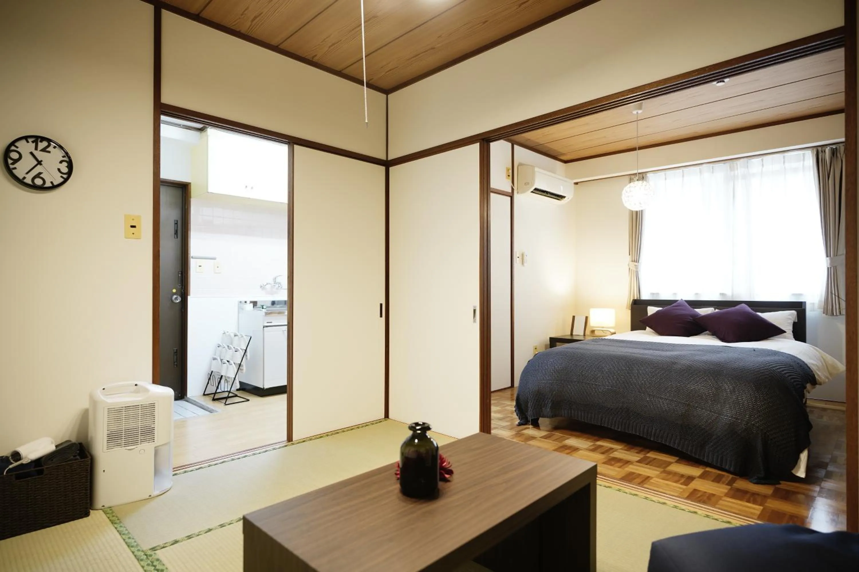 Dining area, Bed in Naha Southerlies Condominium Kumoji