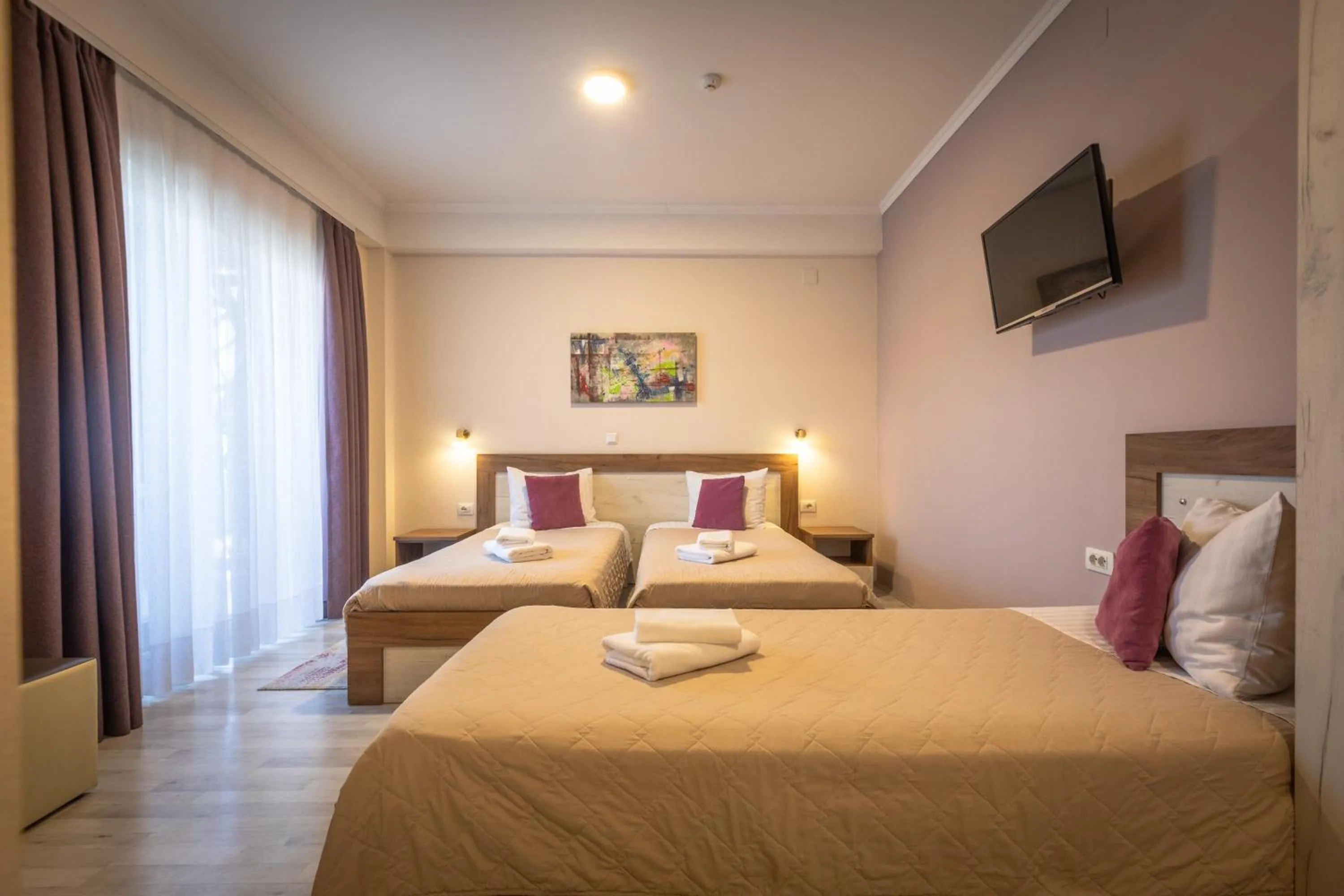 TV and multimedia, Bed in Boulevard Apartments