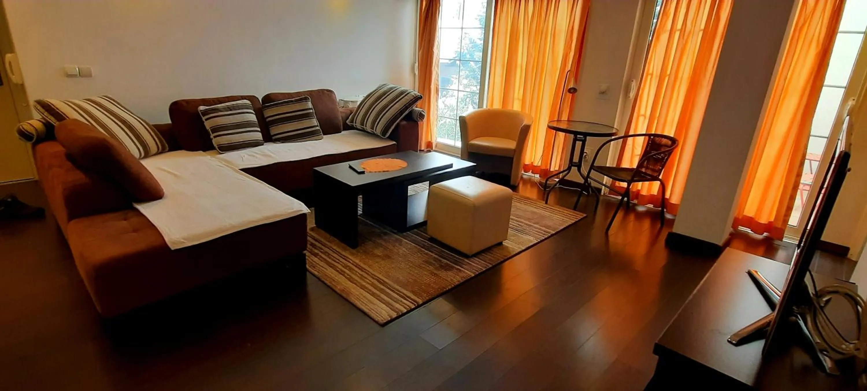 Living room in Aloha Apartments with pool