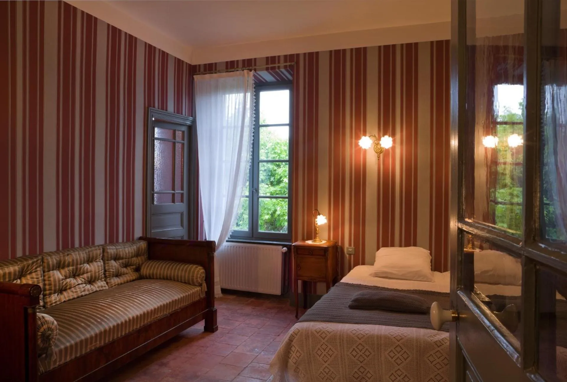 Seating area, Bed in Logis Hotel - Restaurant La Marbrerie