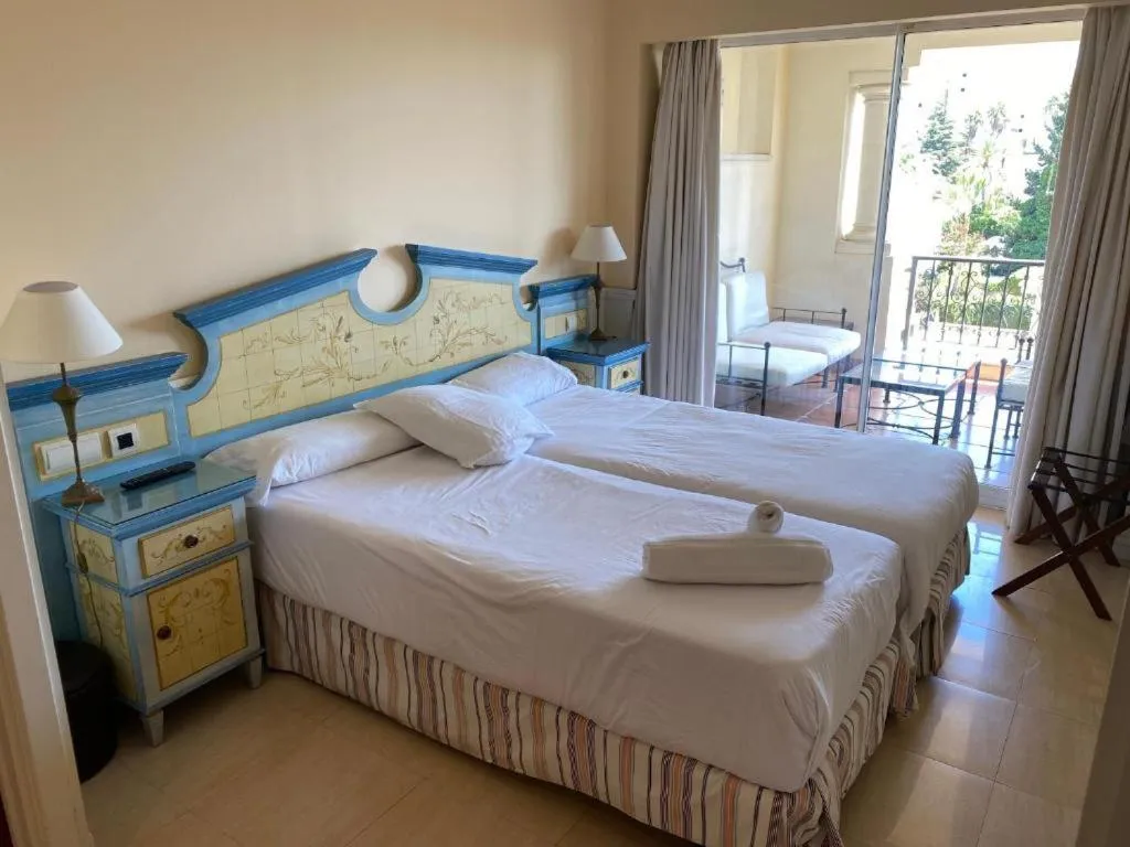 Bed in Apartamentos Guadalpin Boutique