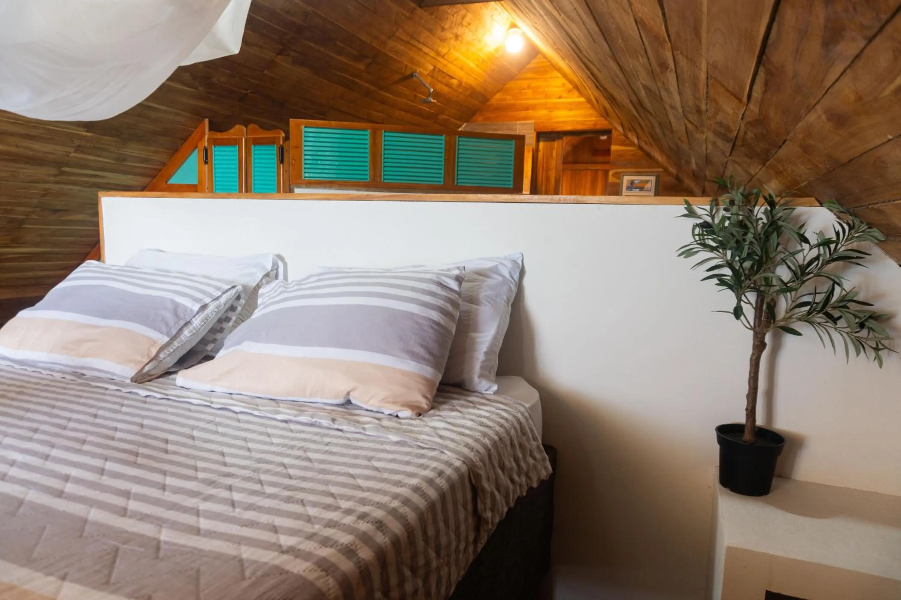 Bed in Hotel Calamari Baru