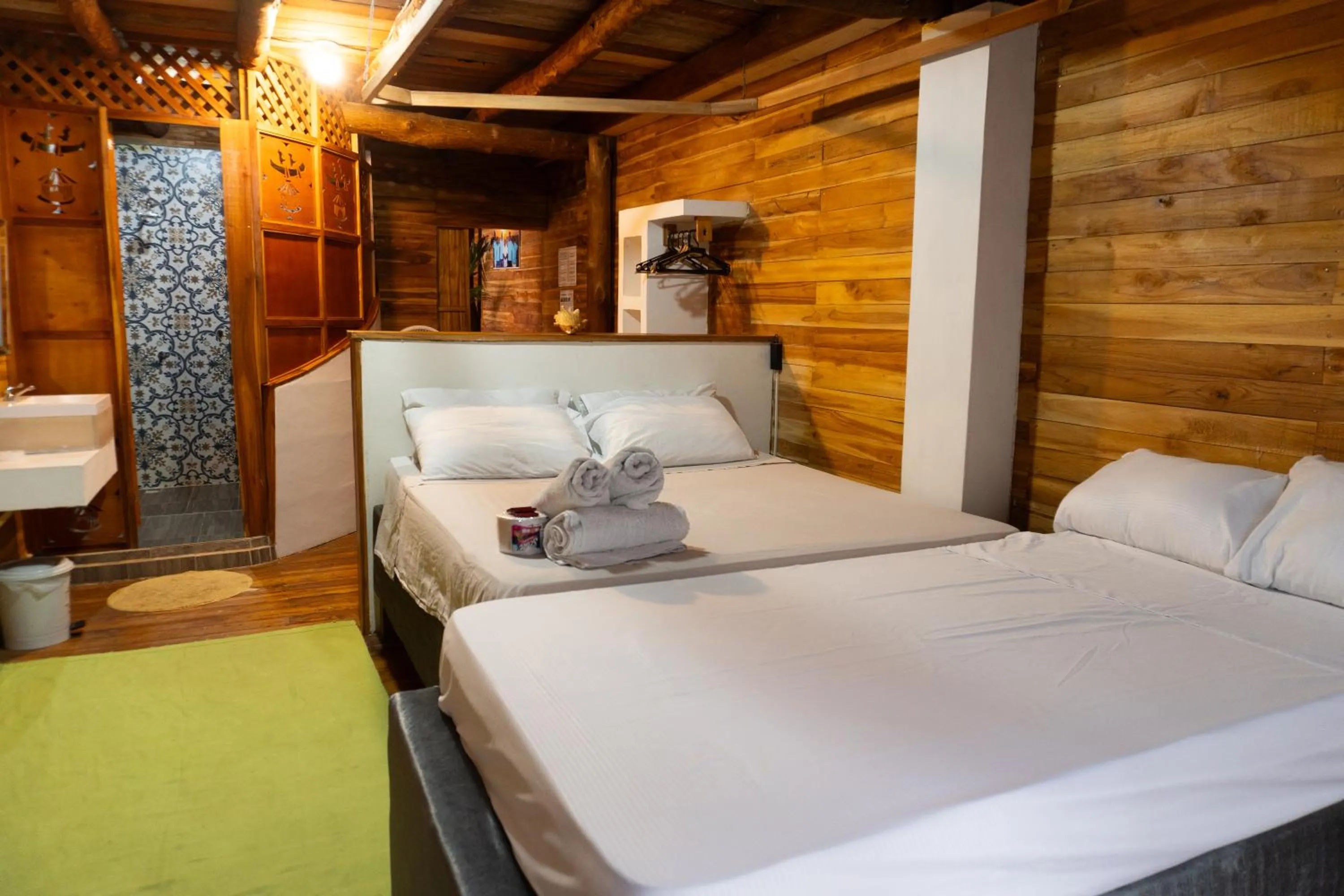 Bed in Hotel Calamari Baru