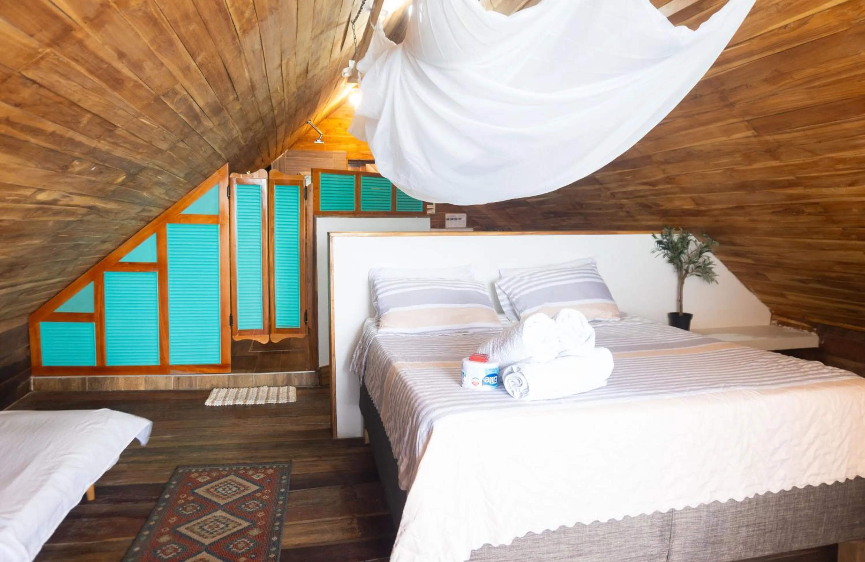 Bed in Hotel Calamari Baru