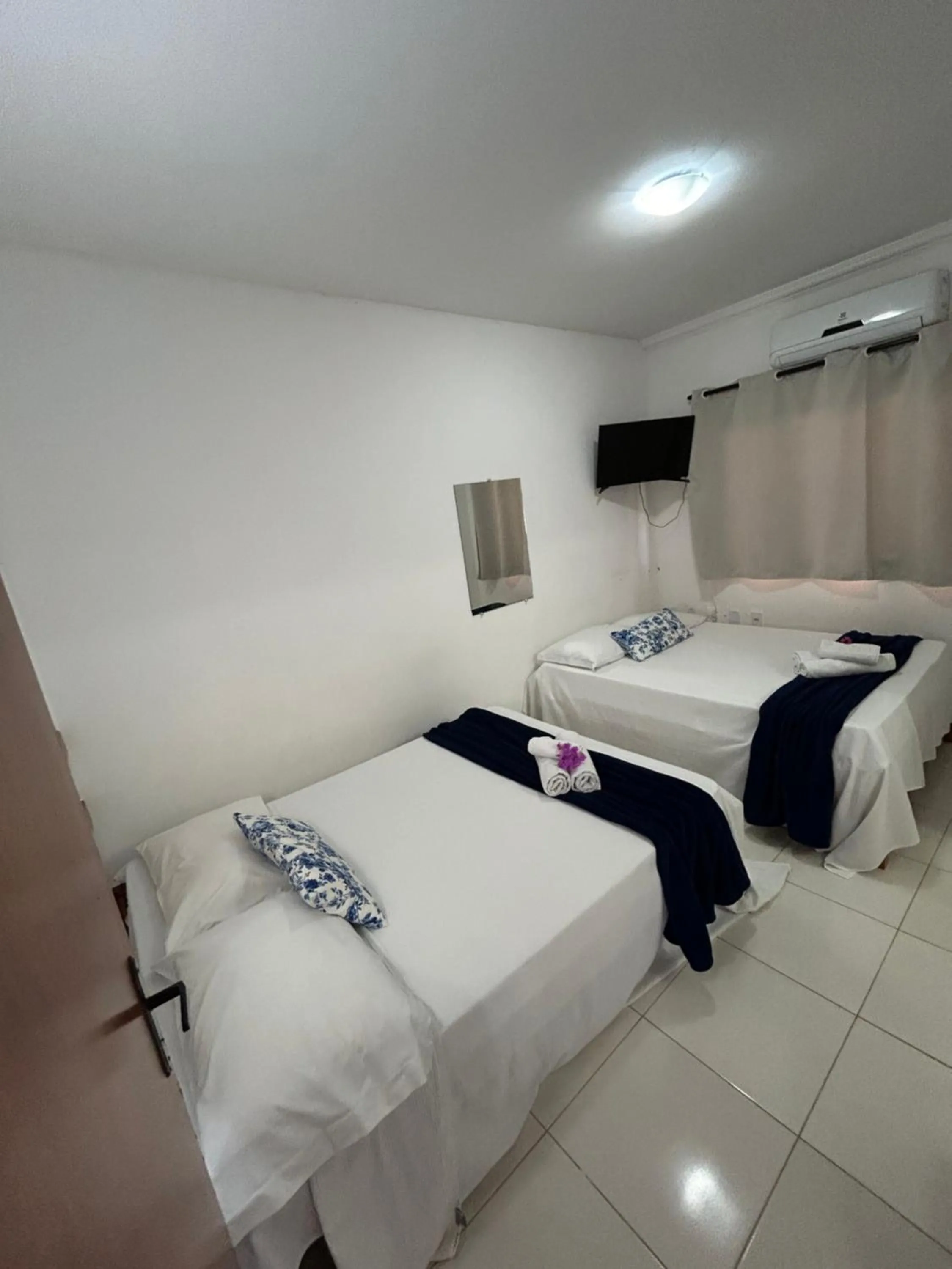 Bed in Pousada Cellina’s mar