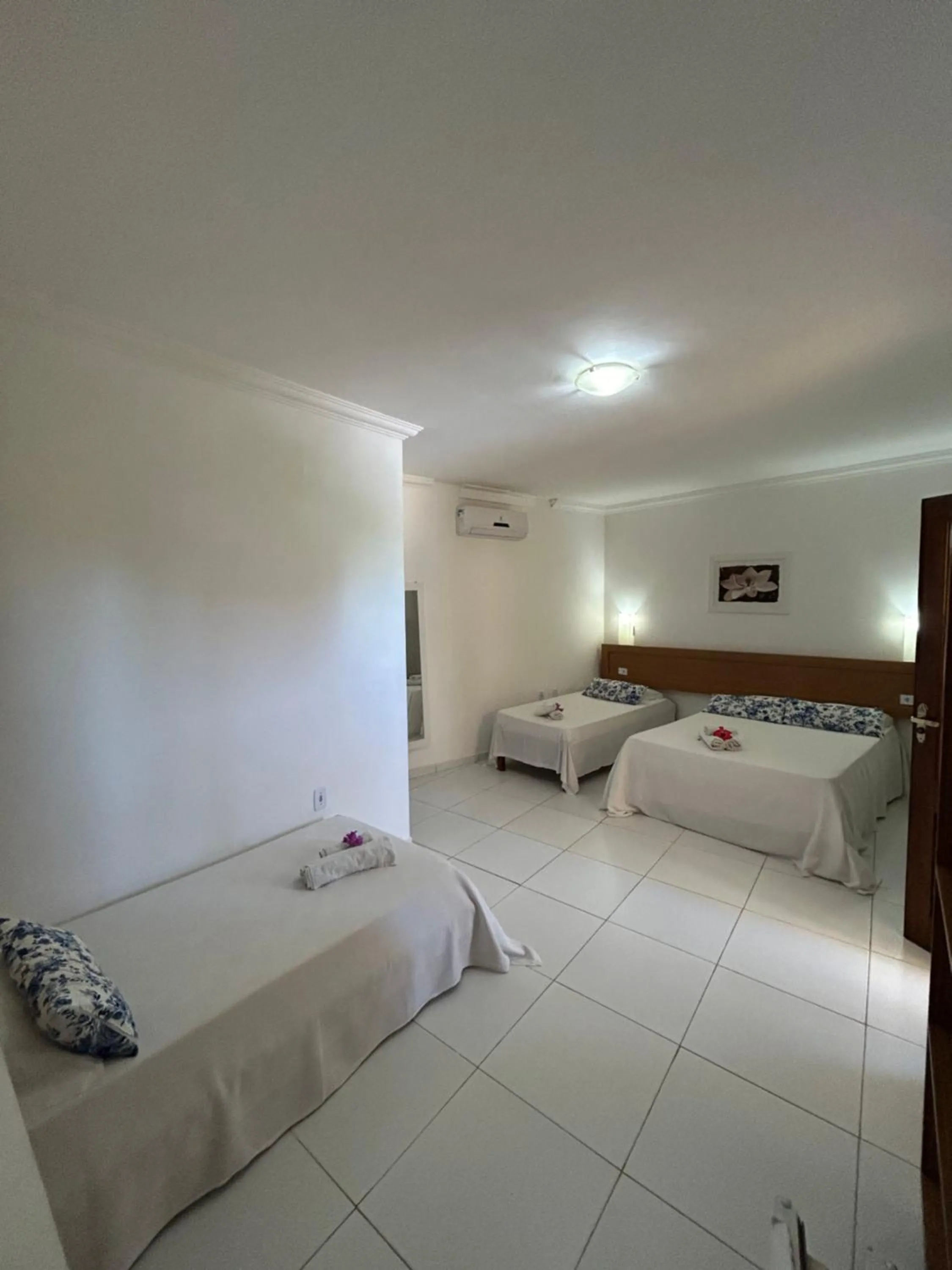 Bed in Pousada Cellina’s mar