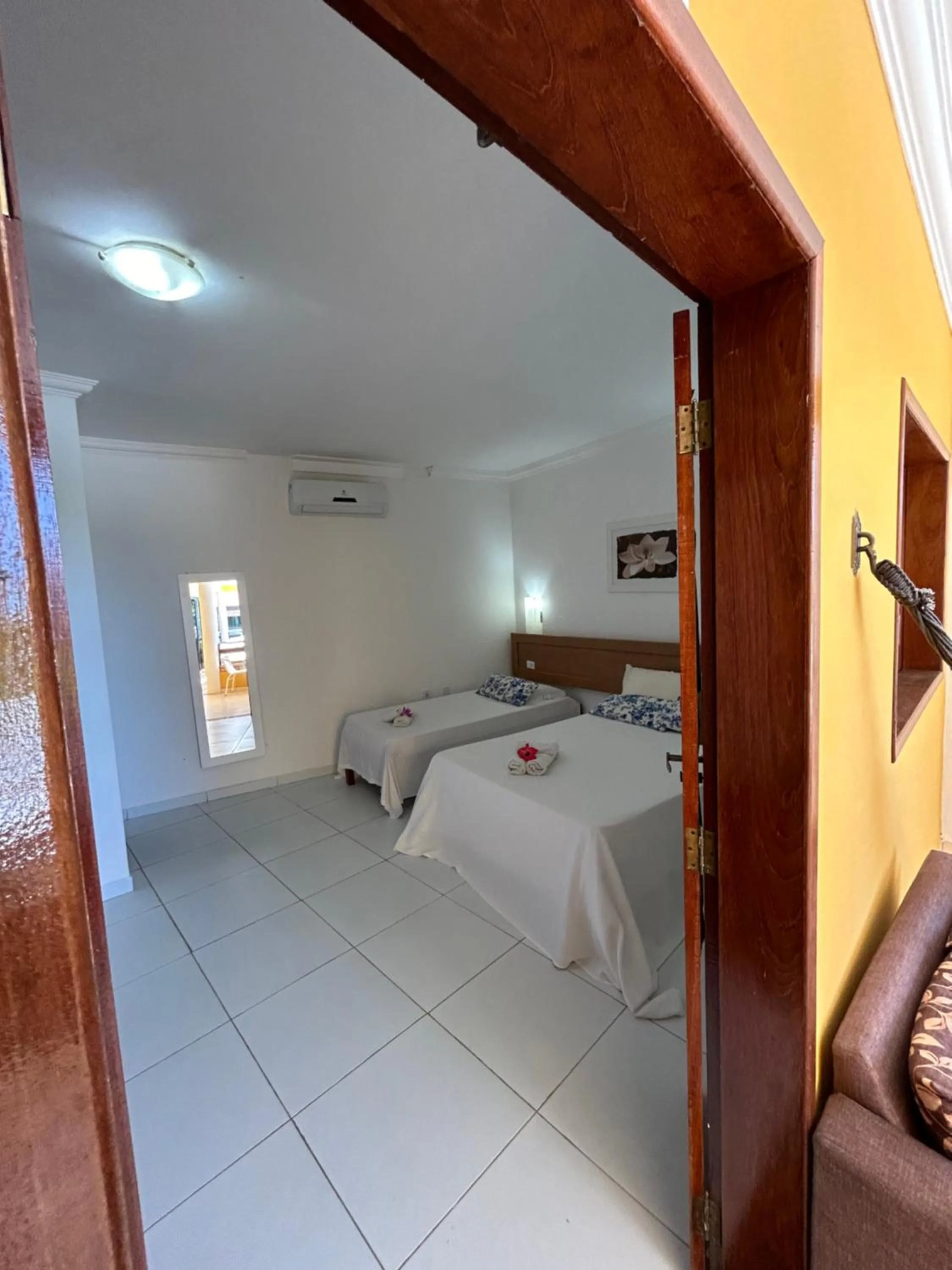 Bed in Pousada Cellina’s mar