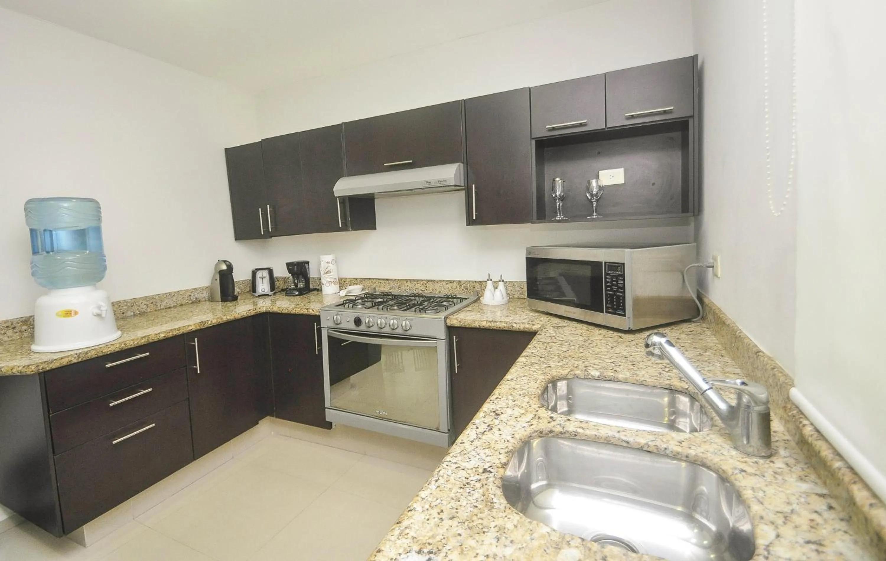 Kitchen or kitchenette in Phenomenal Location Near Beach & 5th with Stunning Roof Pool