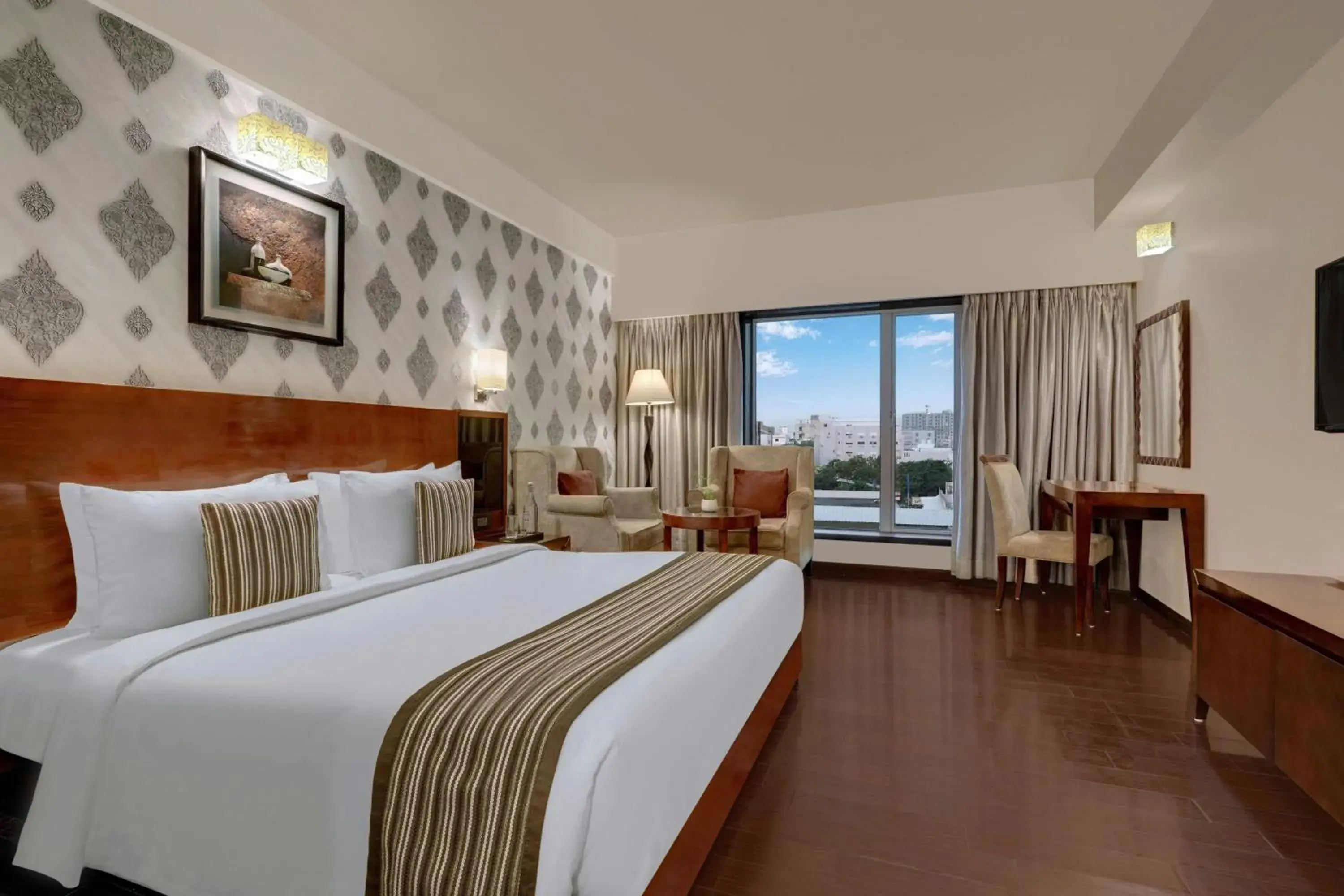 Photo of the whole room, Bed in The Fern Residency Rajkot, Series by Marriott Photo of the whole room, Bed in The Fern Residency Rajkot, Series by Marriott