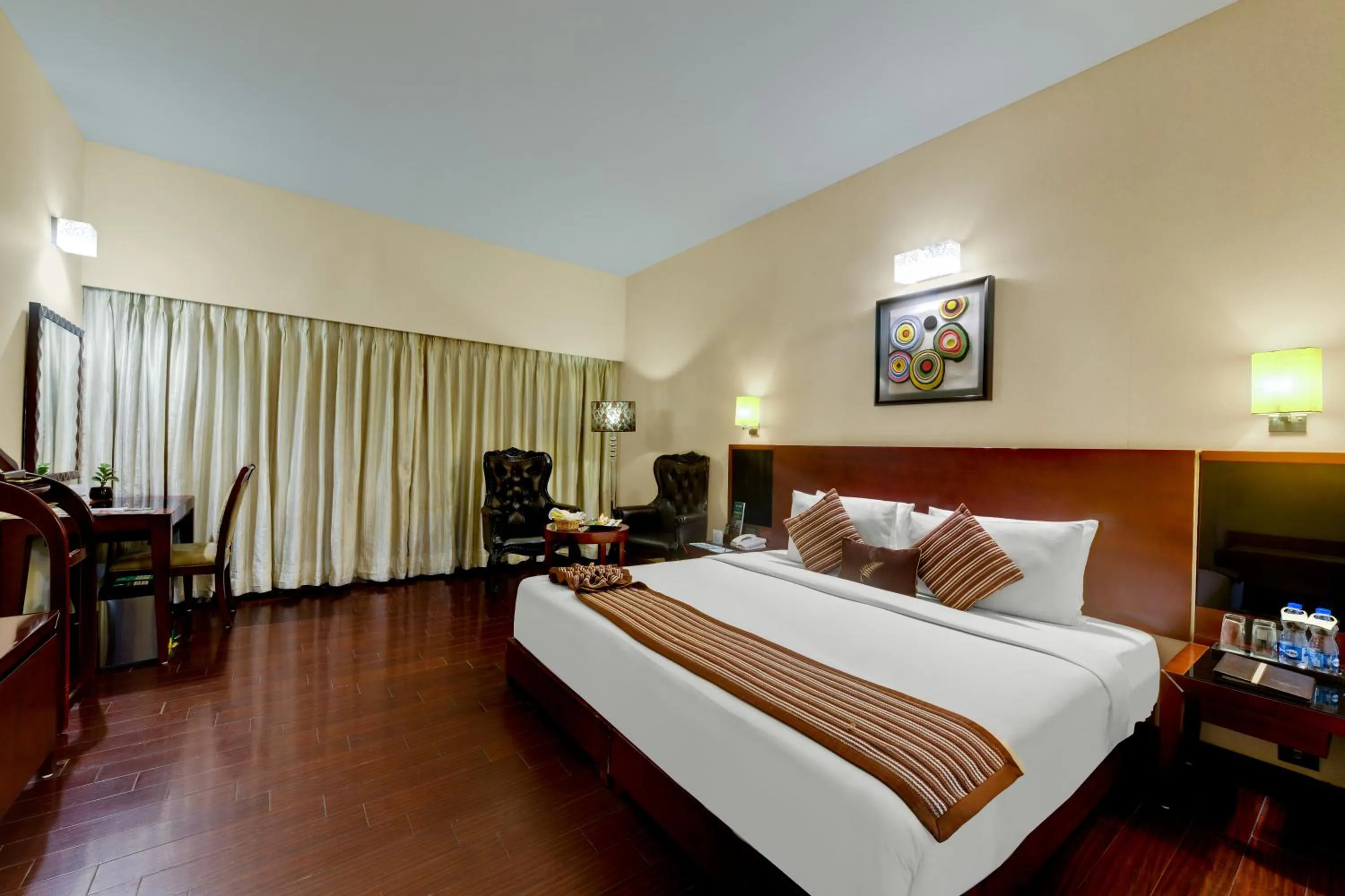 Photo of the whole room, Bed in The Fern Residency Rajkot