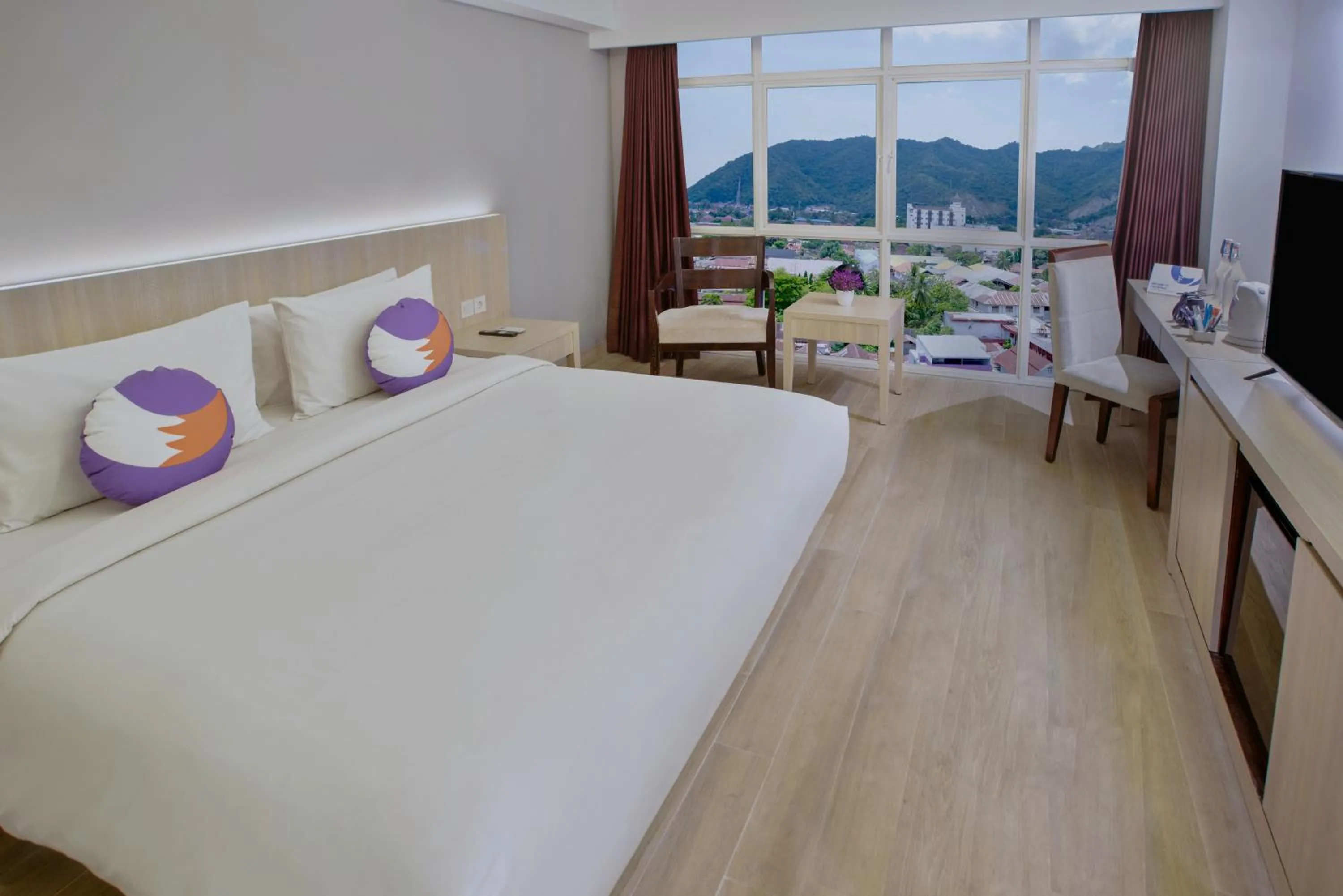 View (from property/room), Bed in FOX Hotel Gorontalo