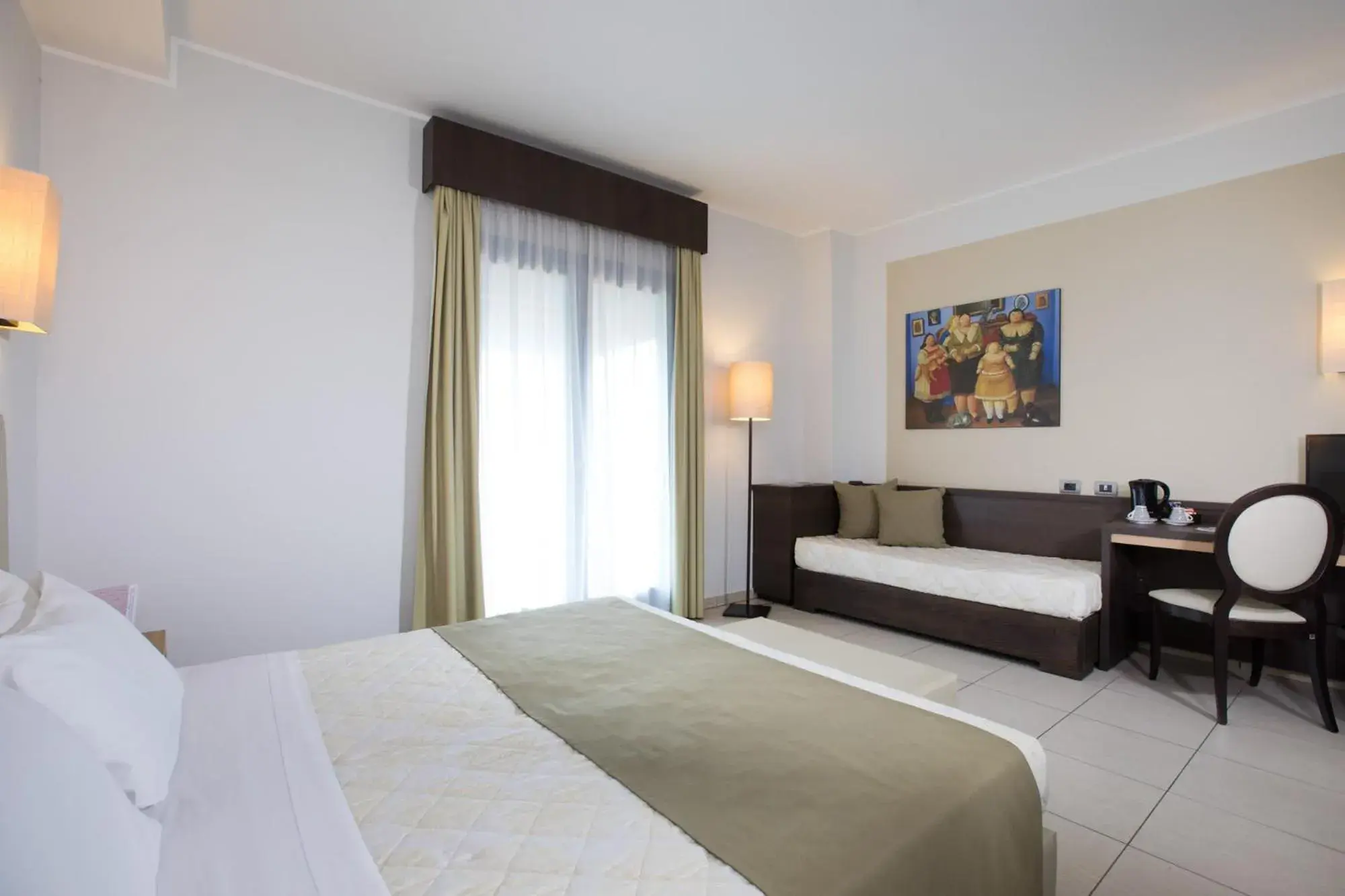 Triple Room with Balcony in Lu' Hotel Carbonia Triple Room with Balcony in Lu' Hotel Carbonia