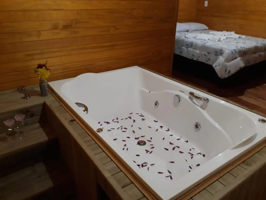 Bed in Pousada rio canoas