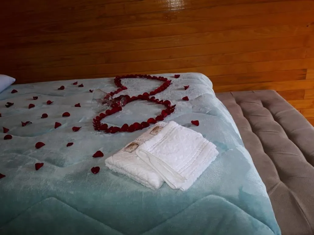 Bed in Pousada rio canoas