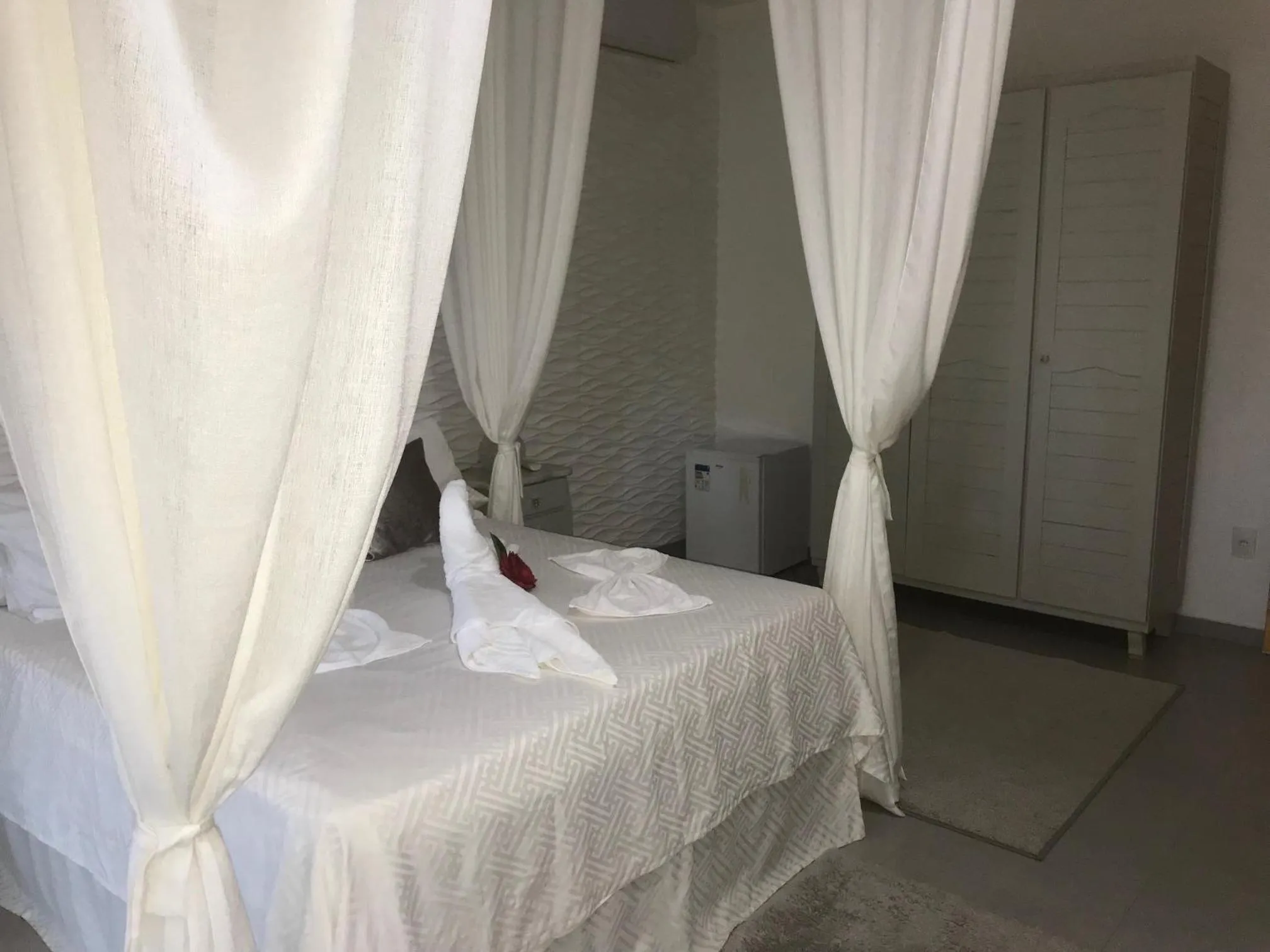 Bed in Relais de Charme Boutique Hotel Pititinga