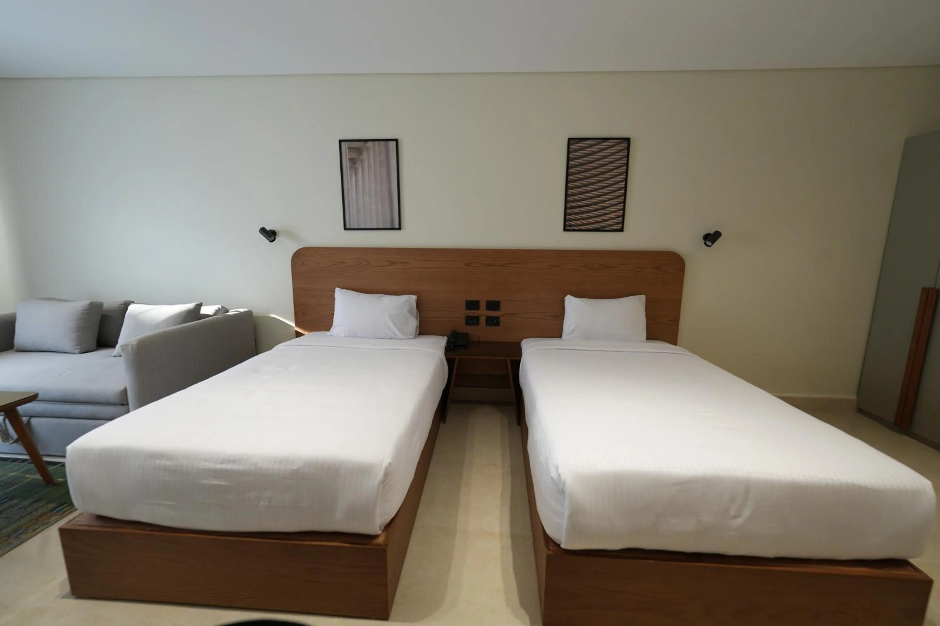 Bed in NewCity Hotel & Suites
