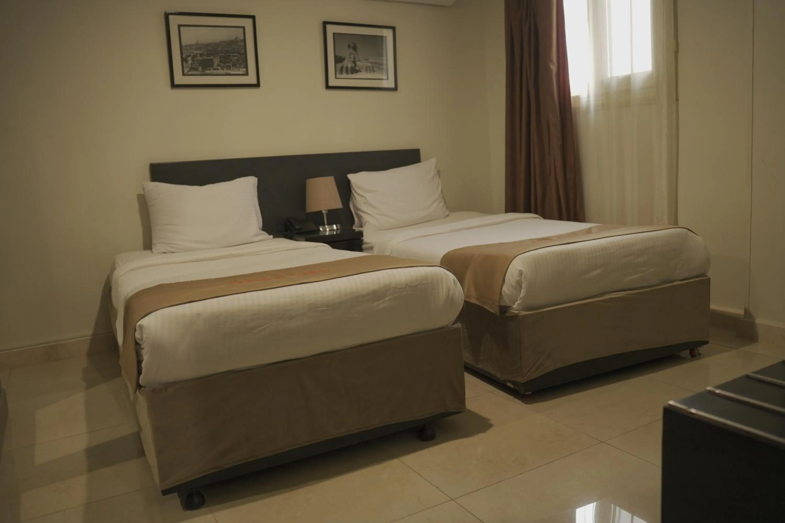 Bed in NewCity Hotel & Suites