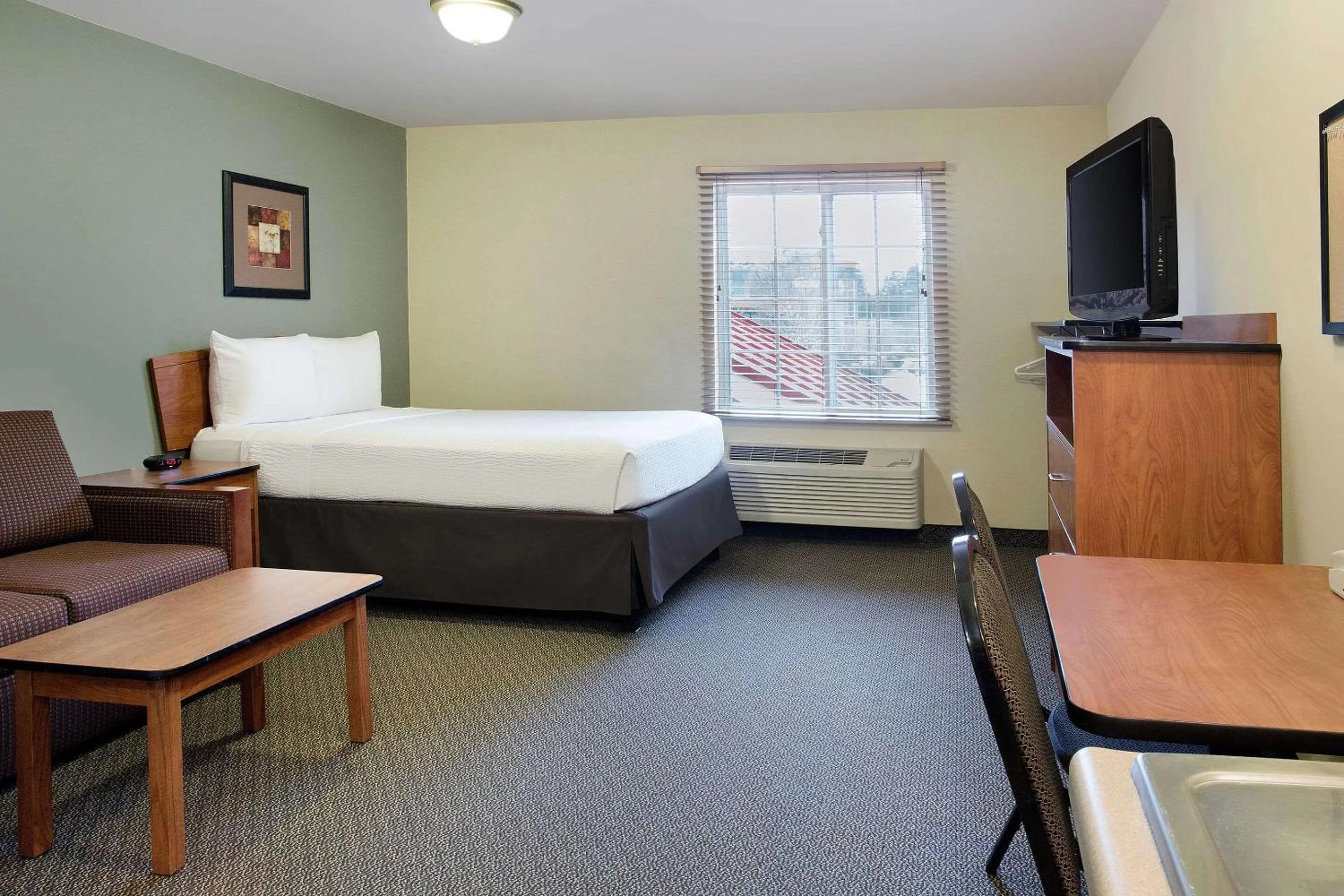 Photo of the whole room, Bed in WoodSpring Suites Raleigh Northeast Wake Forest