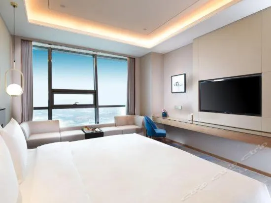 Bed in Auto City Ruili Hotel