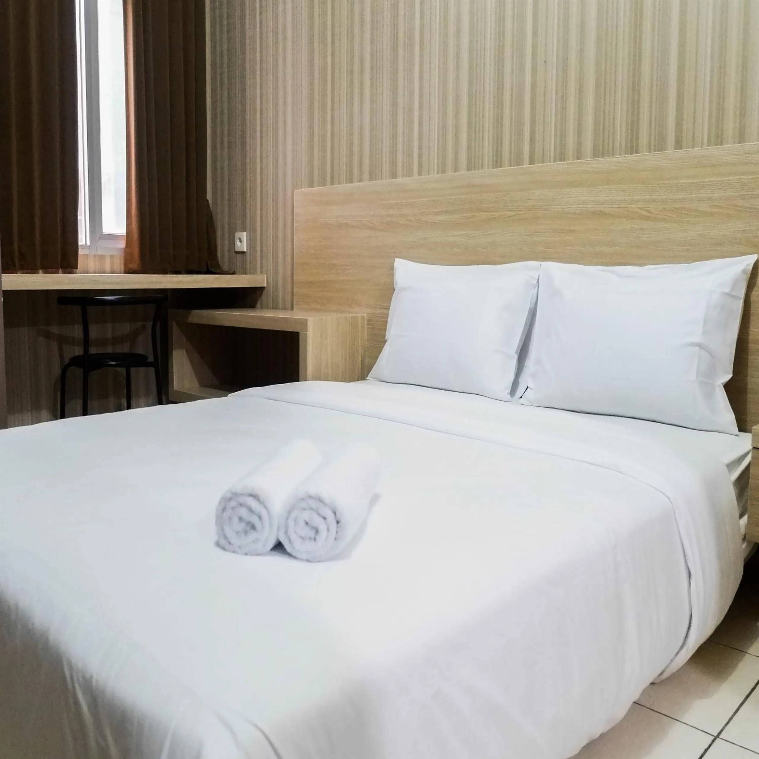 Bed in Modern Studio Apartment at Pavilion Permata 2 By Travelio