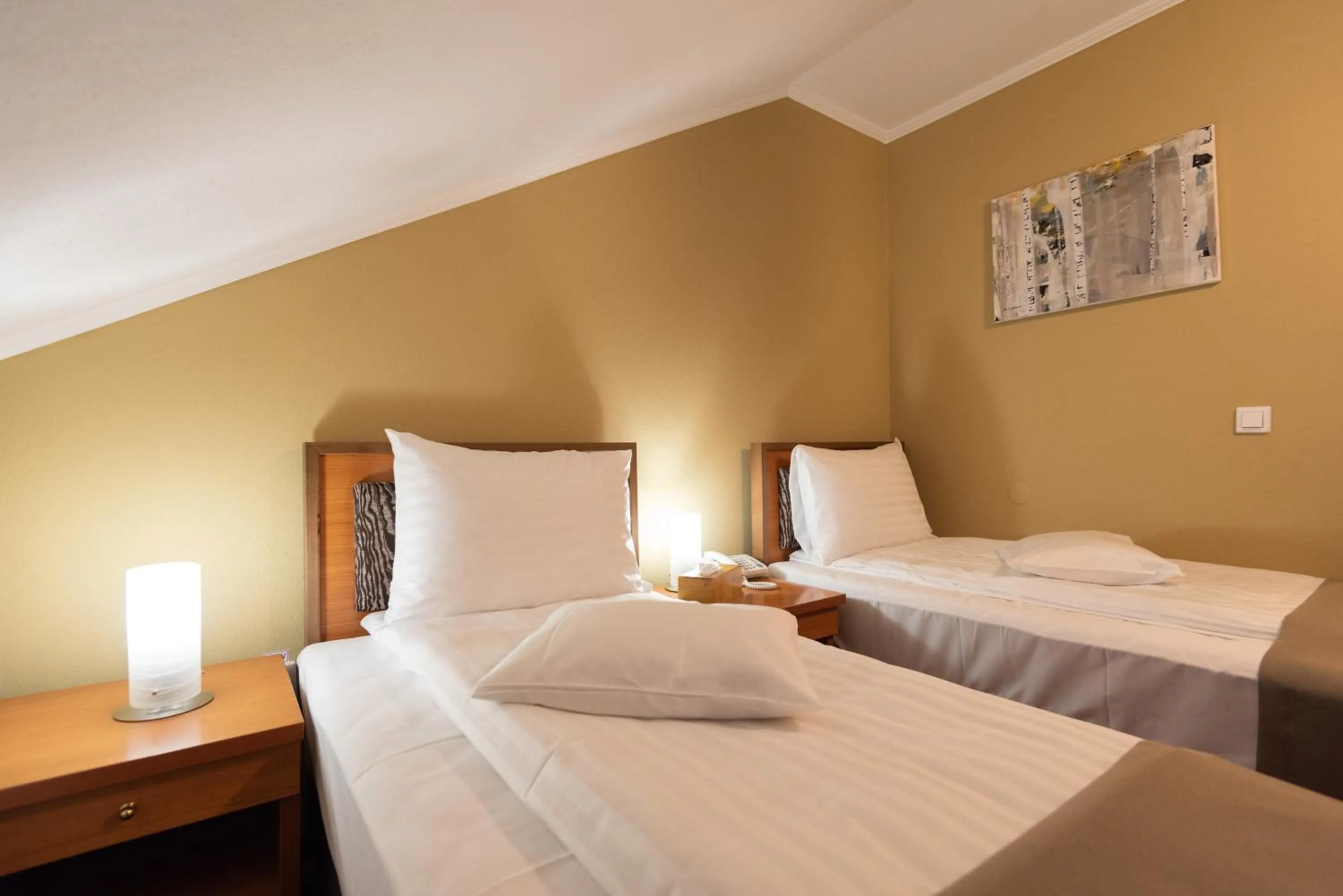 Bed in Areo Hotel & Restaurant