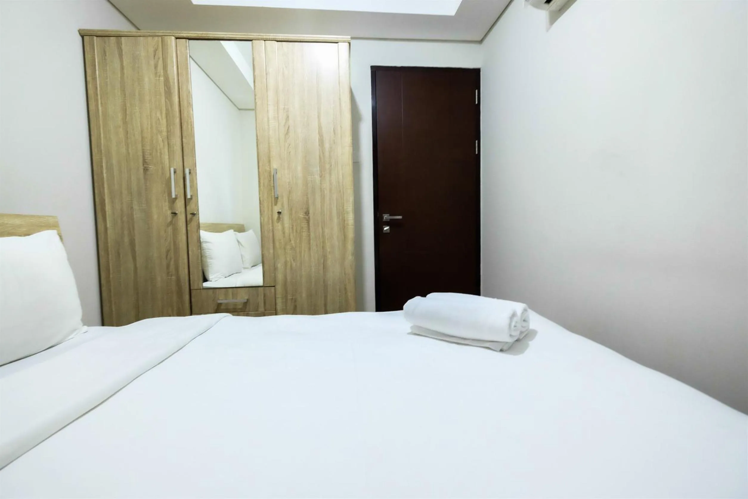 1BR Sky Terrace Lagoon Condo Apartment near Daan Mogot Mall By Travelio