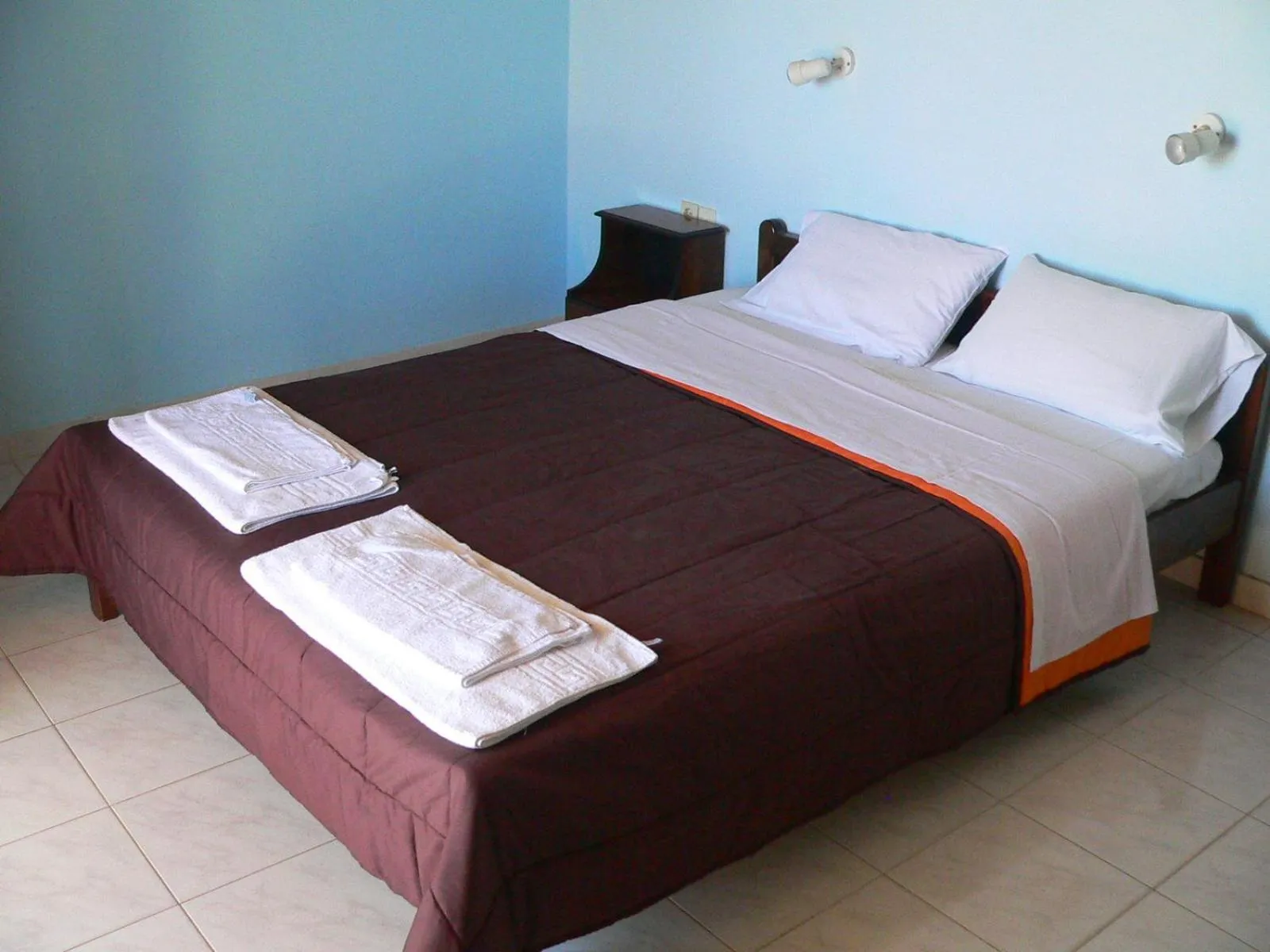 Bed in APRAOS BAY HOTEL