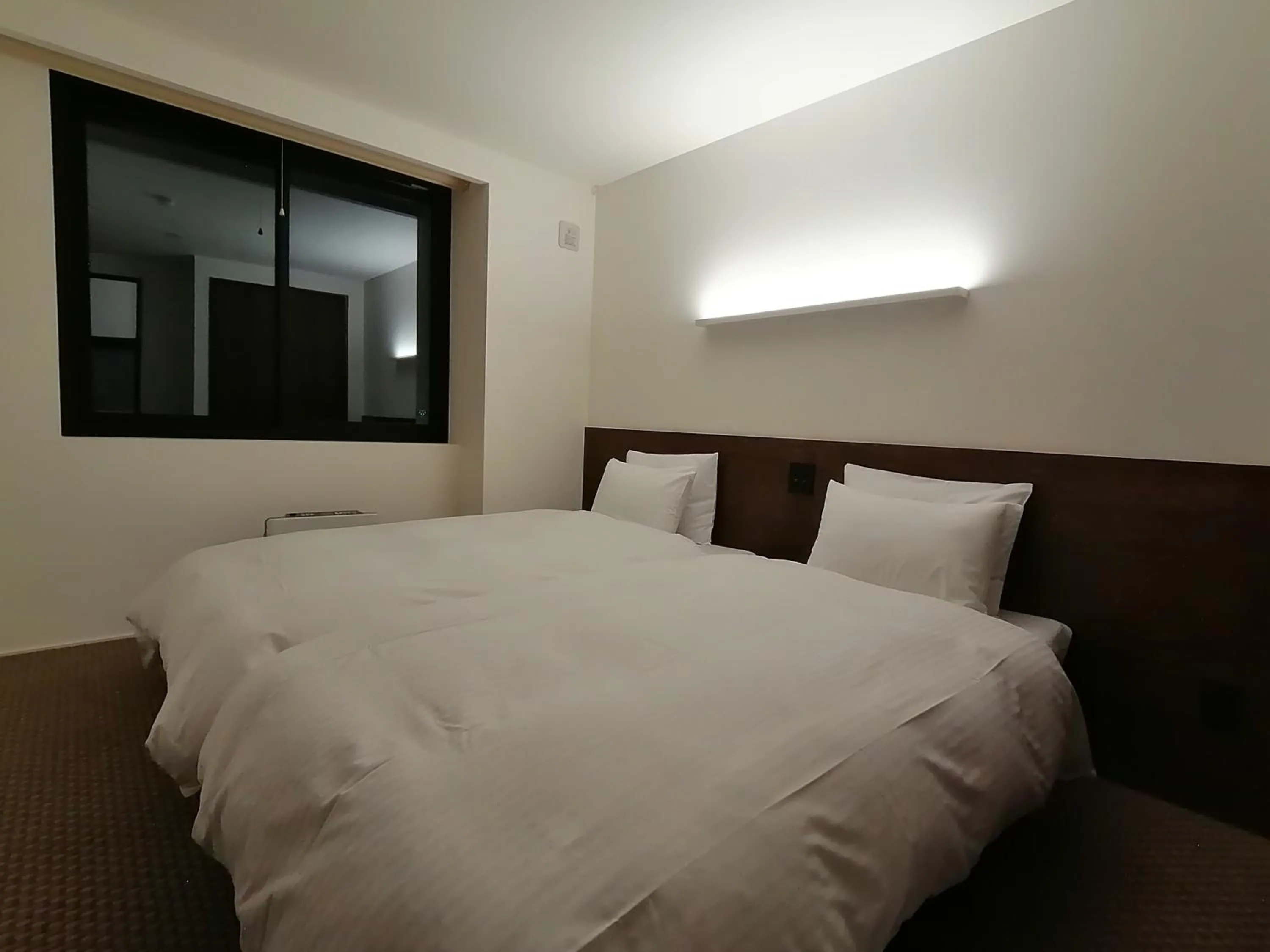 Bed in Fujio Pension Madarao Apartment Hotel & Restaurant