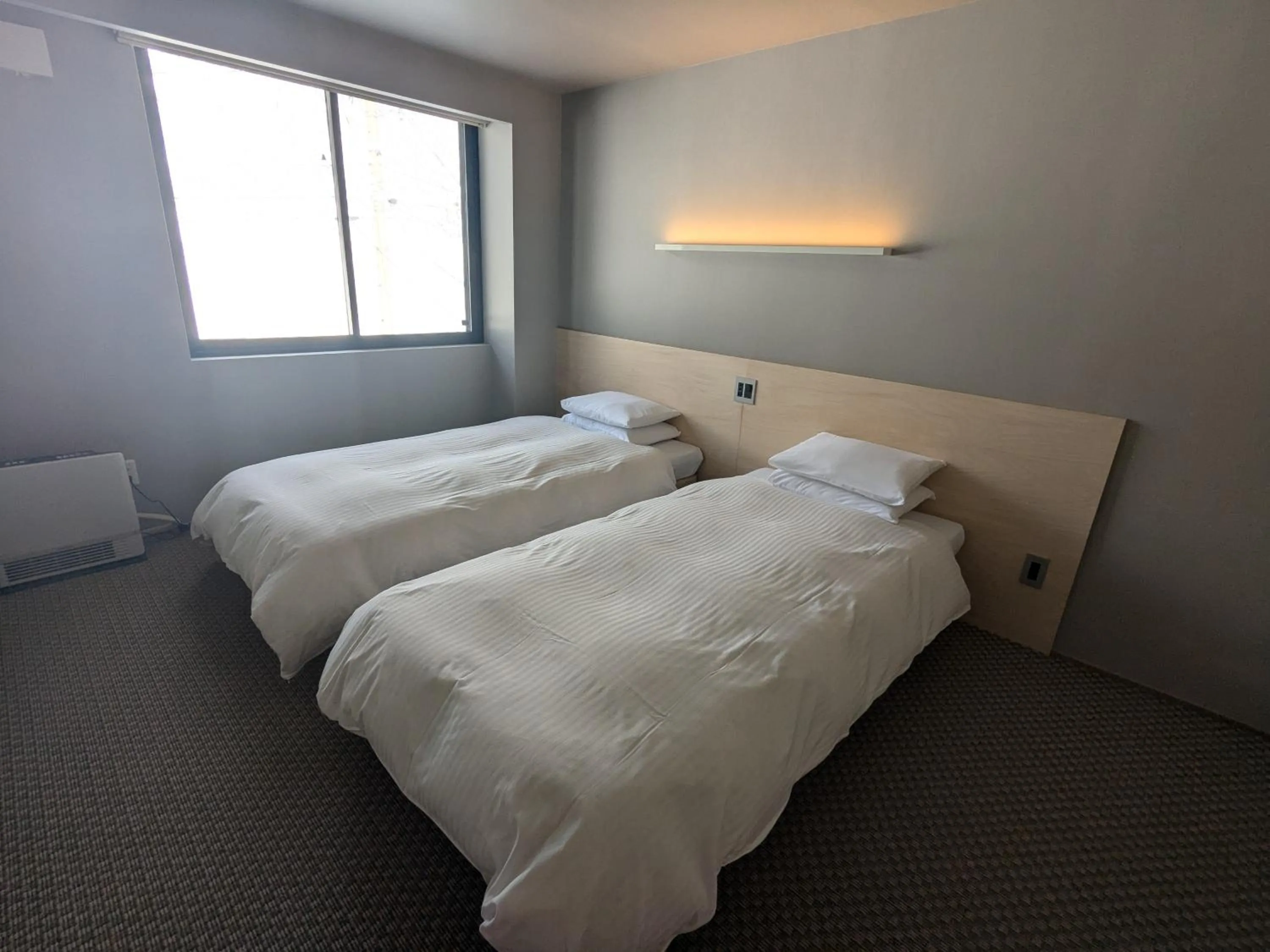 Bed in Fujio Pension Madarao Apartment Hotel & Restaurant