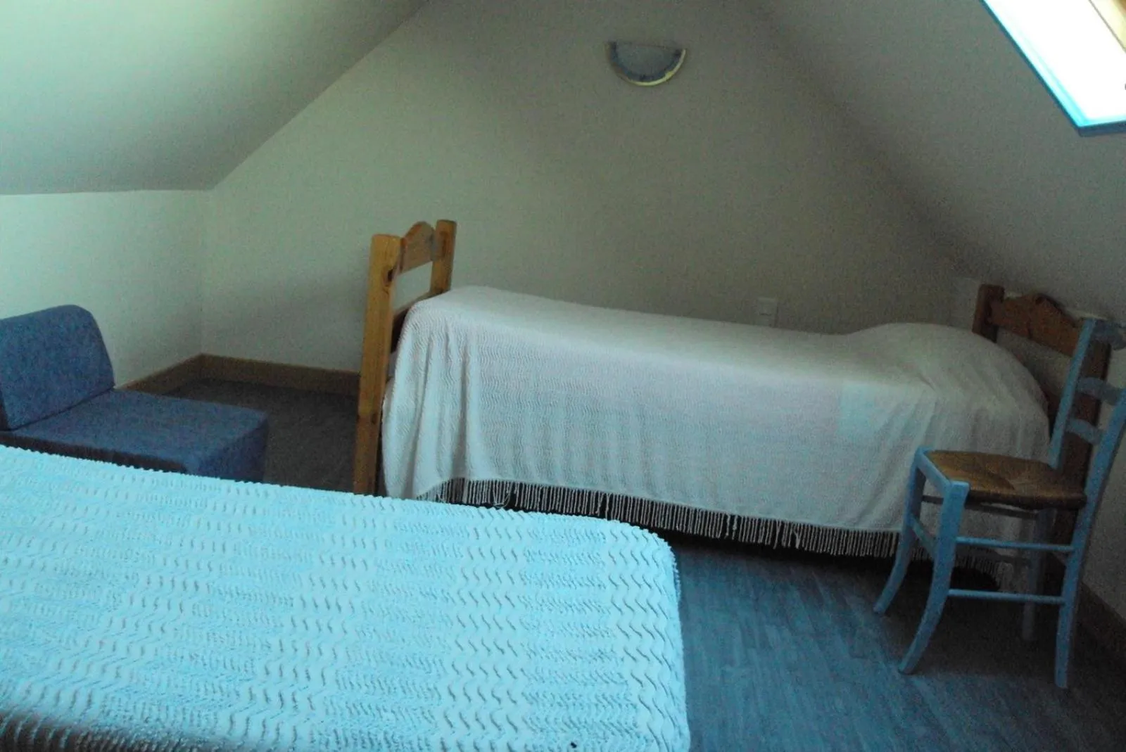 Bed in Gîtes du Ménez-Hom