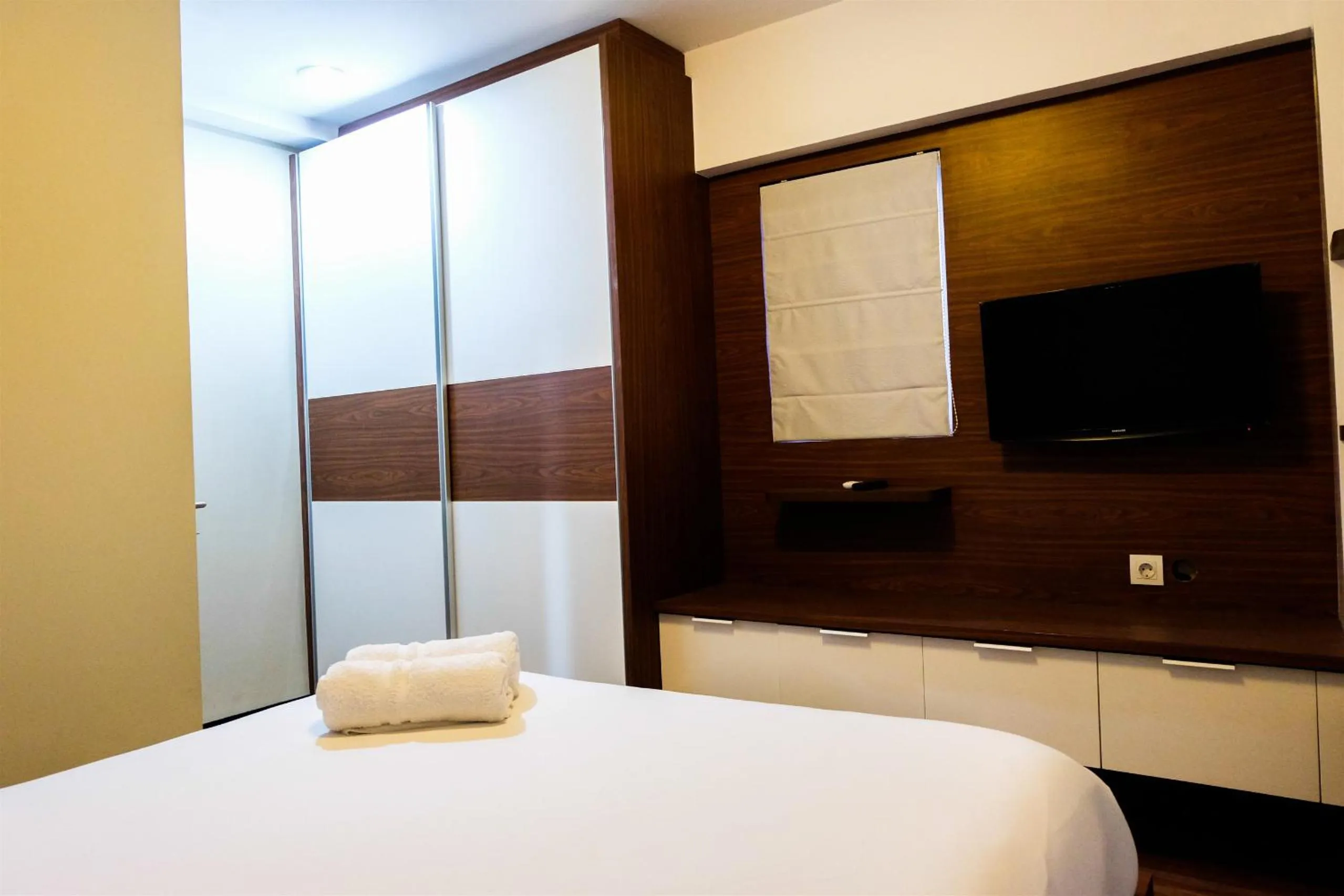 Bed in Amazing 2BR with City View The Wave Kuningan Apartment By Travelio