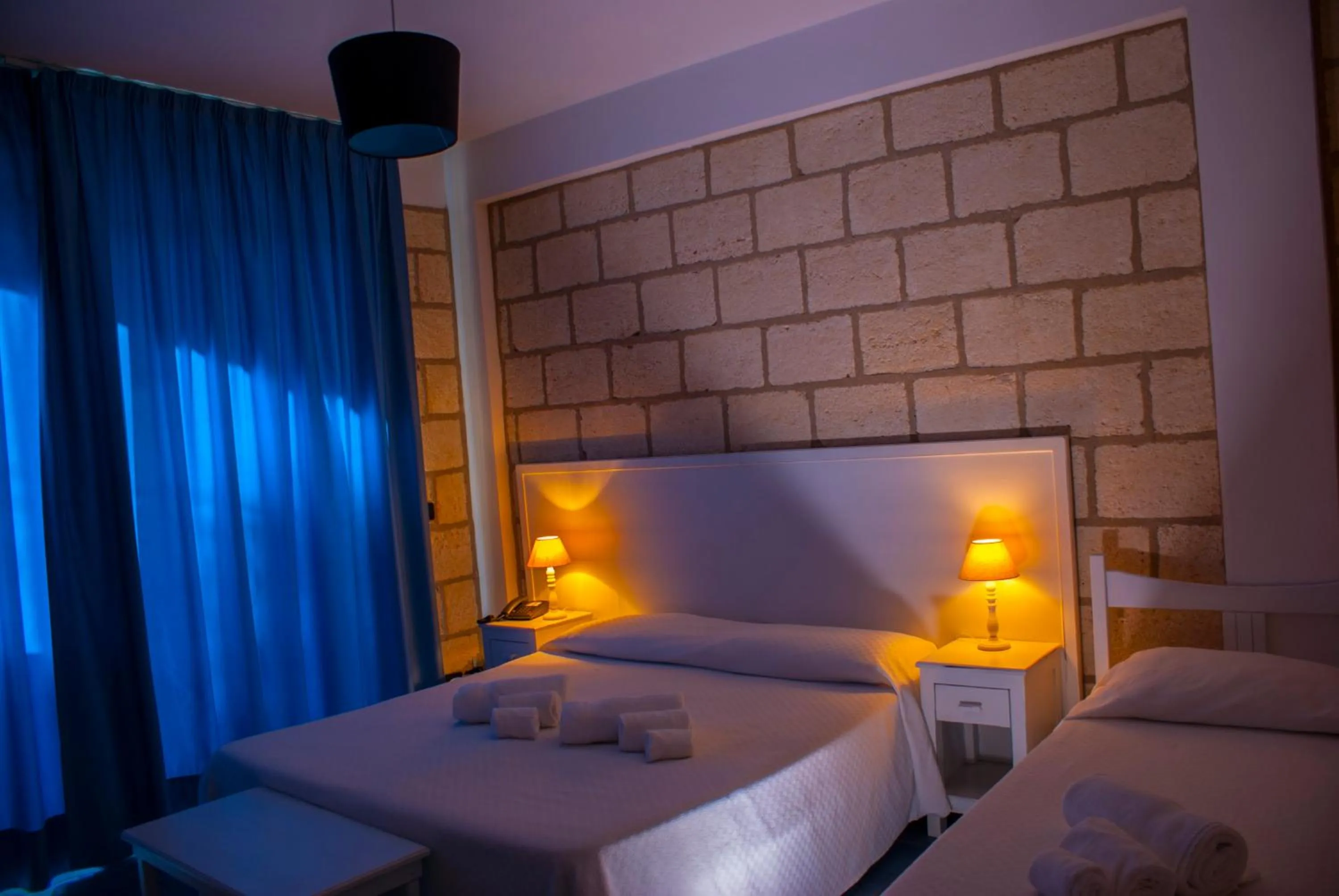 Photo of the whole room, Bed in CapoSperone Resort