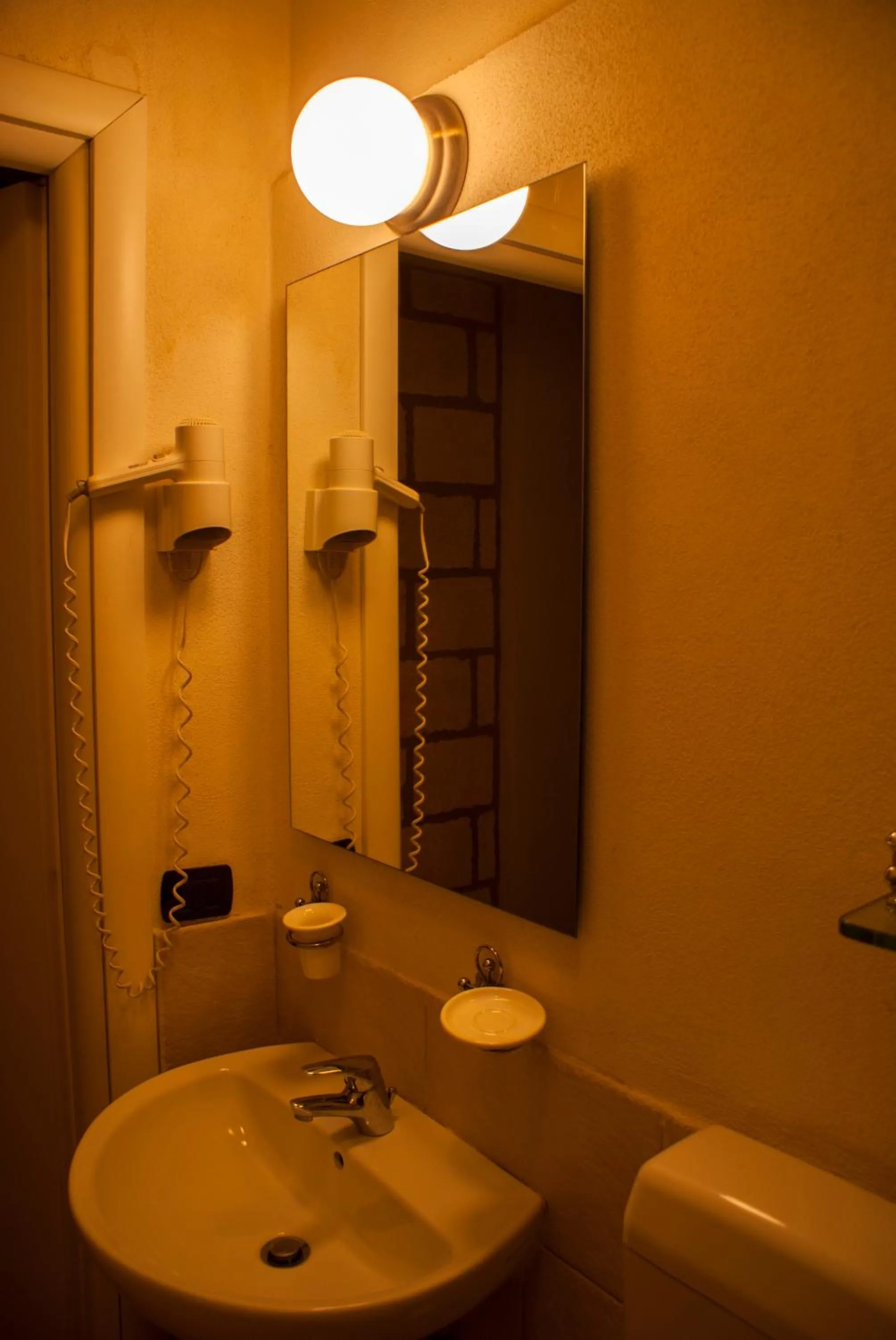 Bathroom in CapoSperone Resort