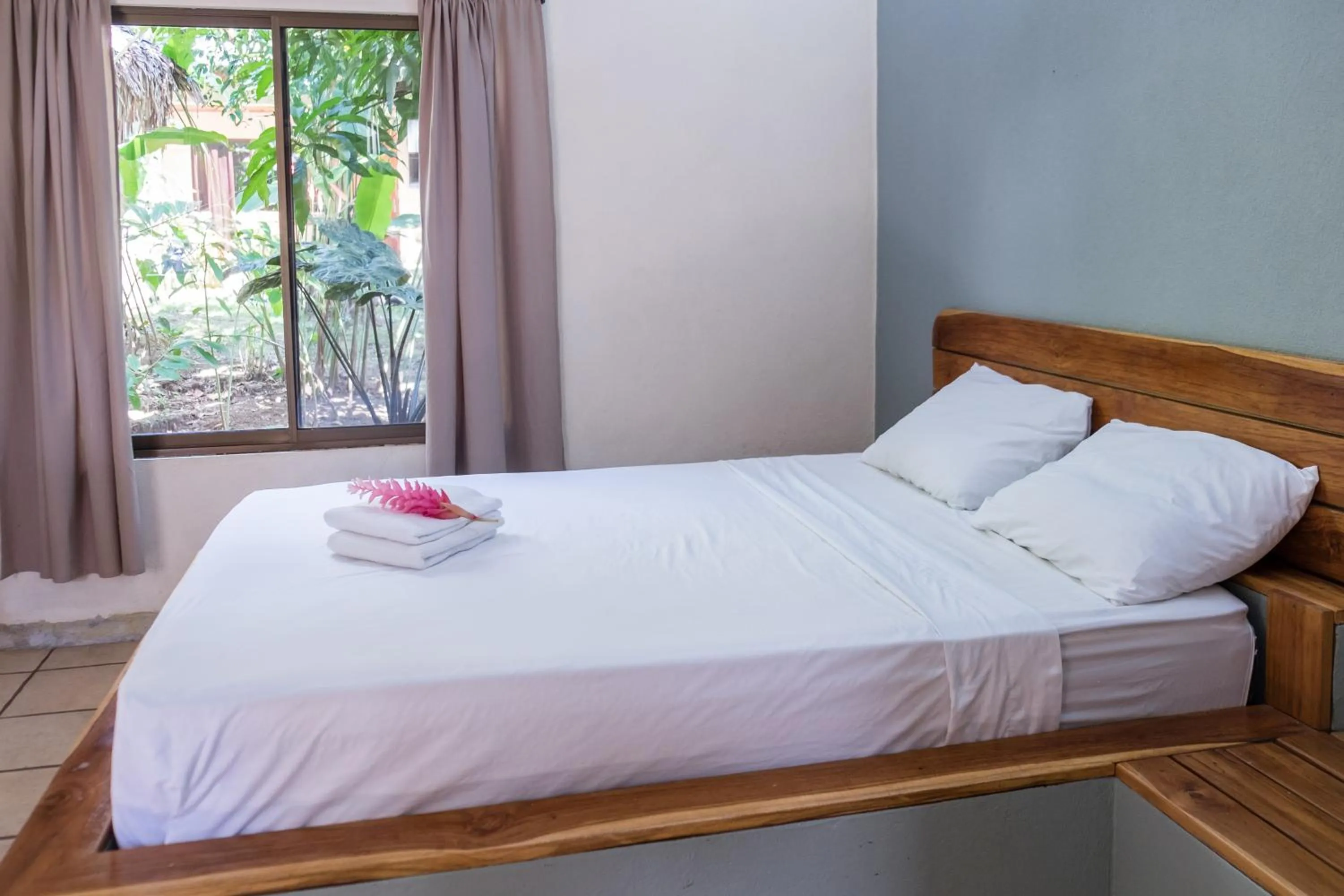 Bed in Zula Inn Aparthotel