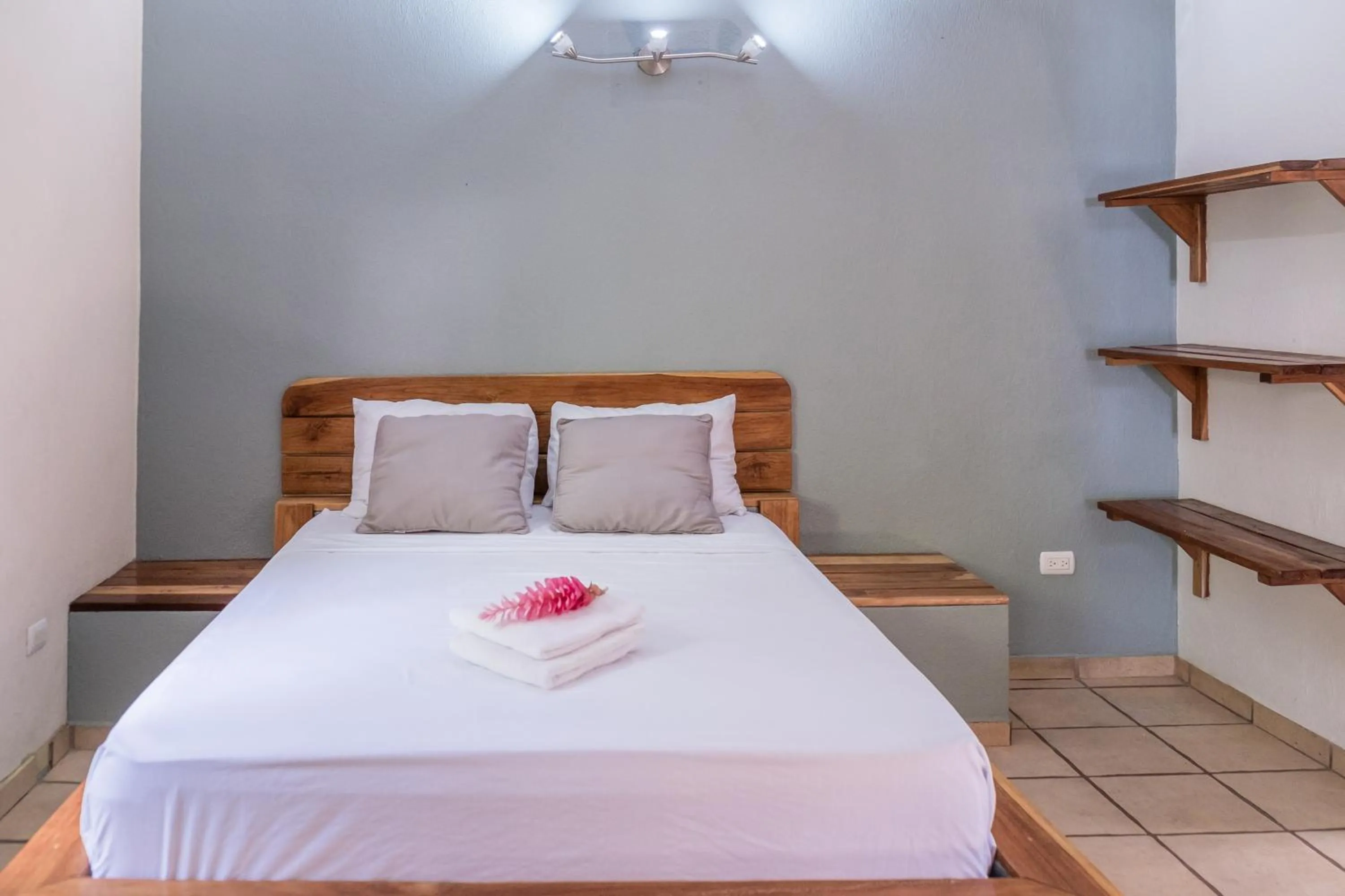 Bed in Zula Inn Aparthotel