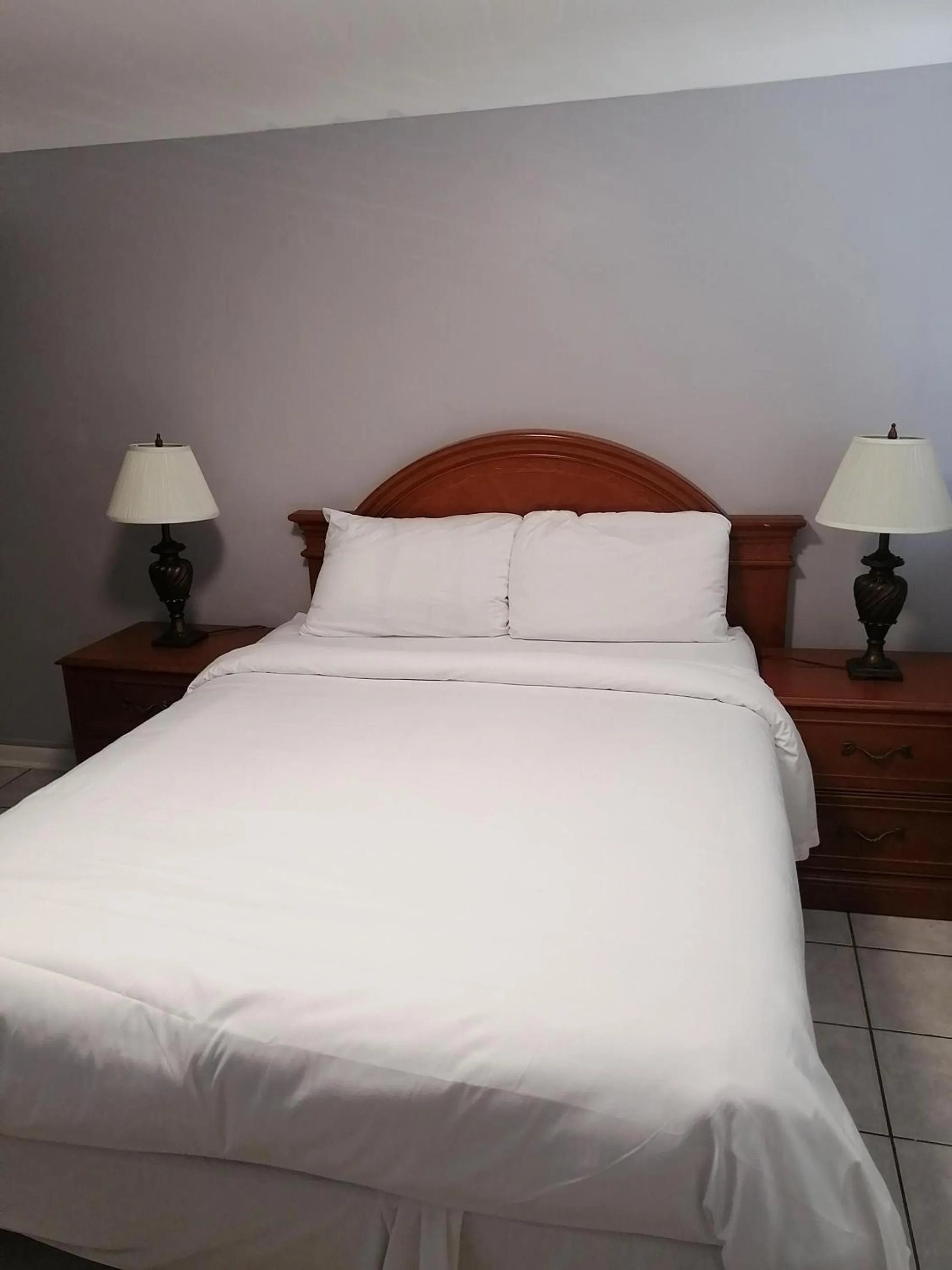 Bed in iCheck Inn Motel