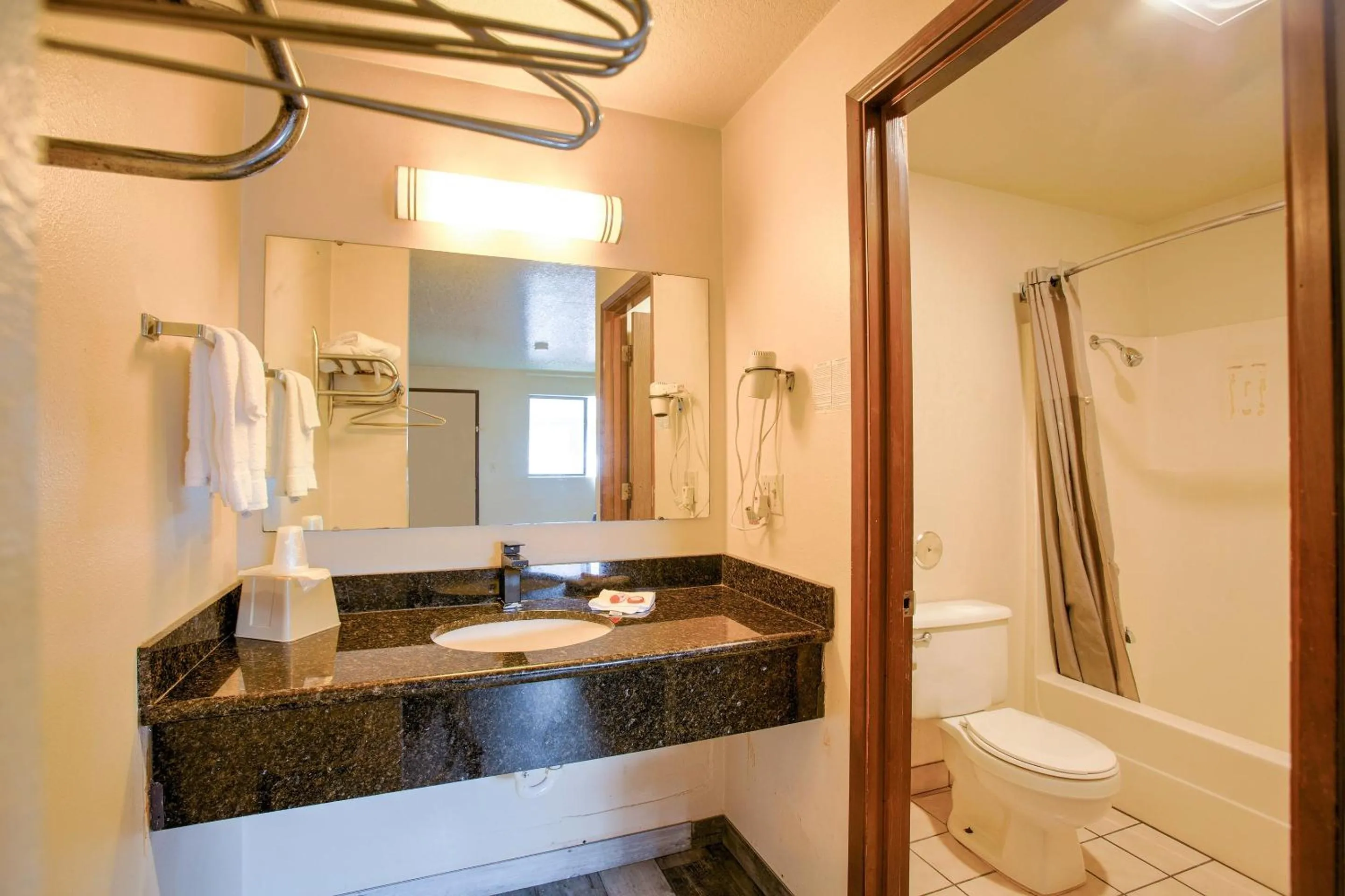 Bathroom in OYO Woodland Hotel and Suites