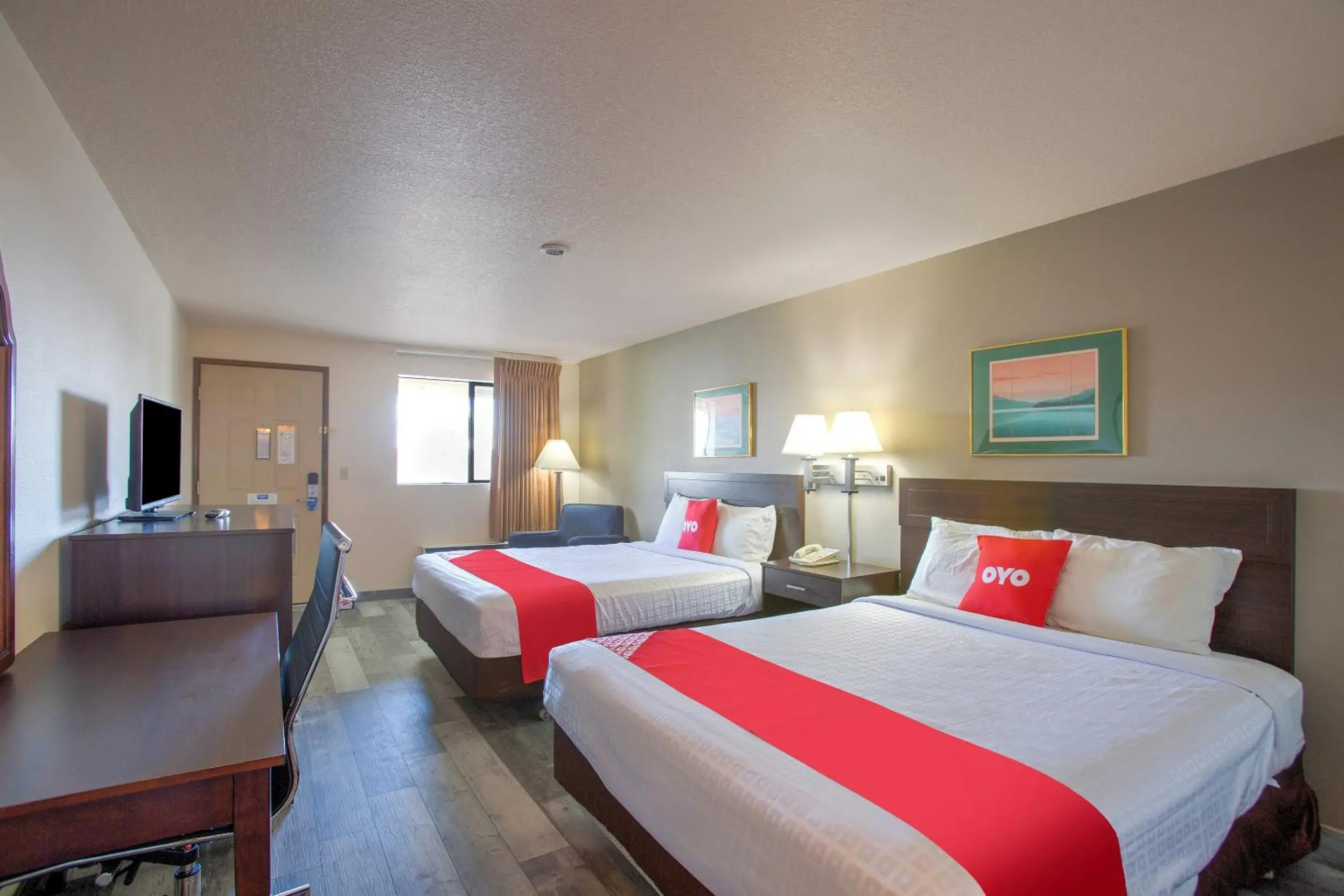 Bedroom, Bed in OYO Woodland Hotel and Suites Bedroom, Bed in OYO Woodland Hotel and Suites