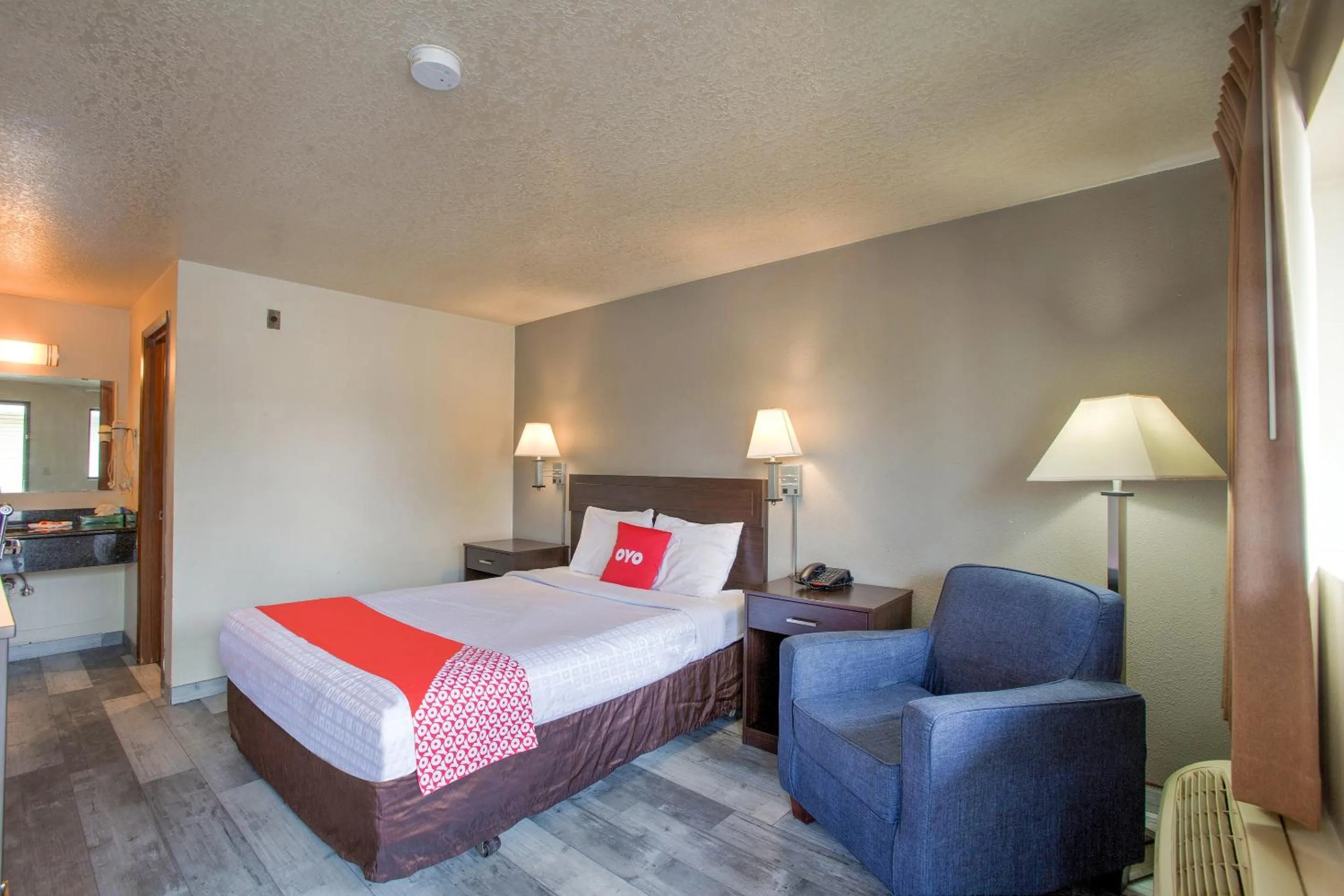 Bedroom, Bed in OYO Woodland Hotel and Suites