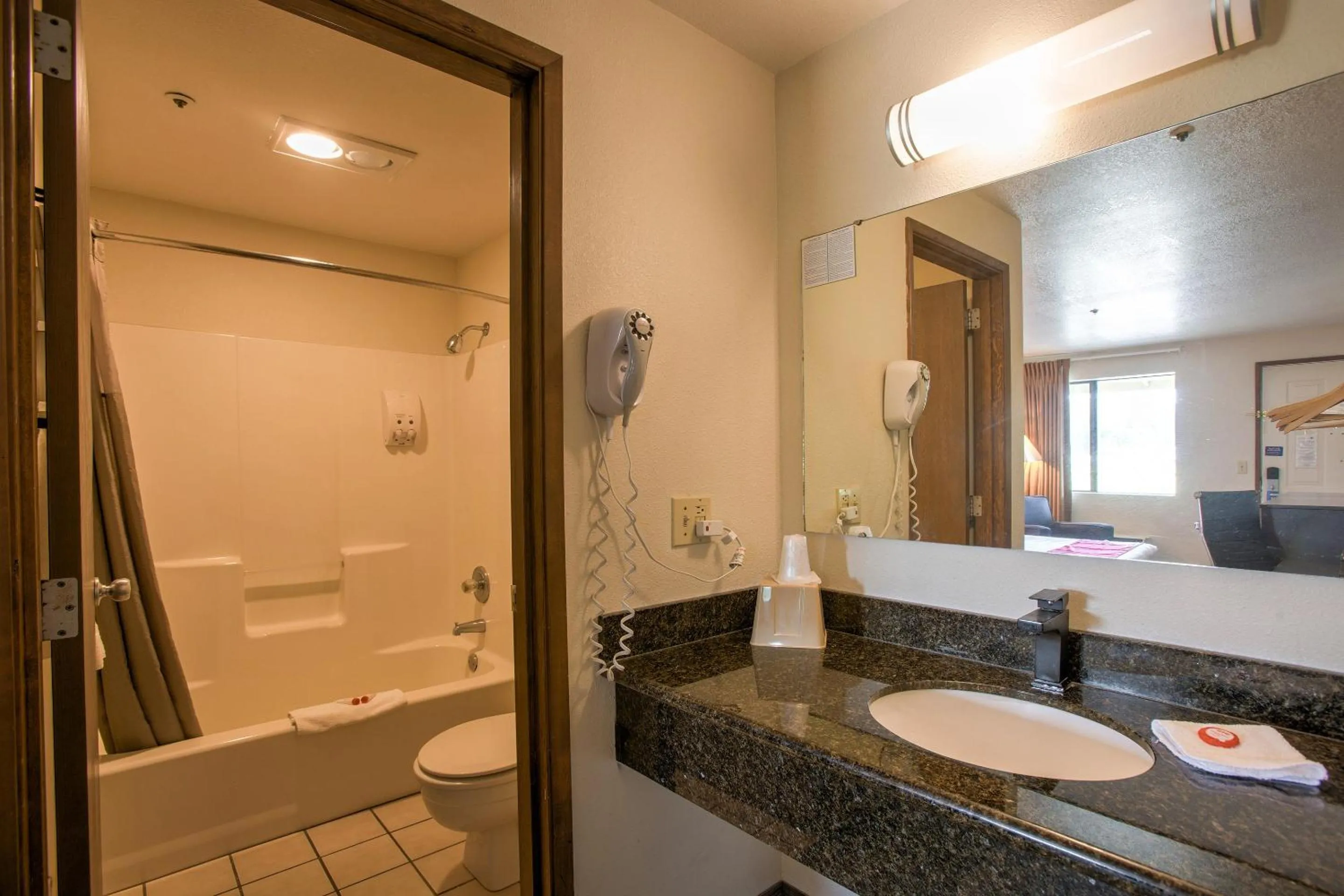 Bathroom in OYO Woodland Hotel and Suites